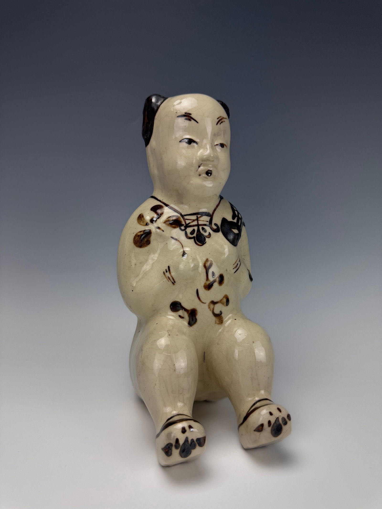 A Chinese Cizhou Kiln Molded Statue Boy (1 of 6)