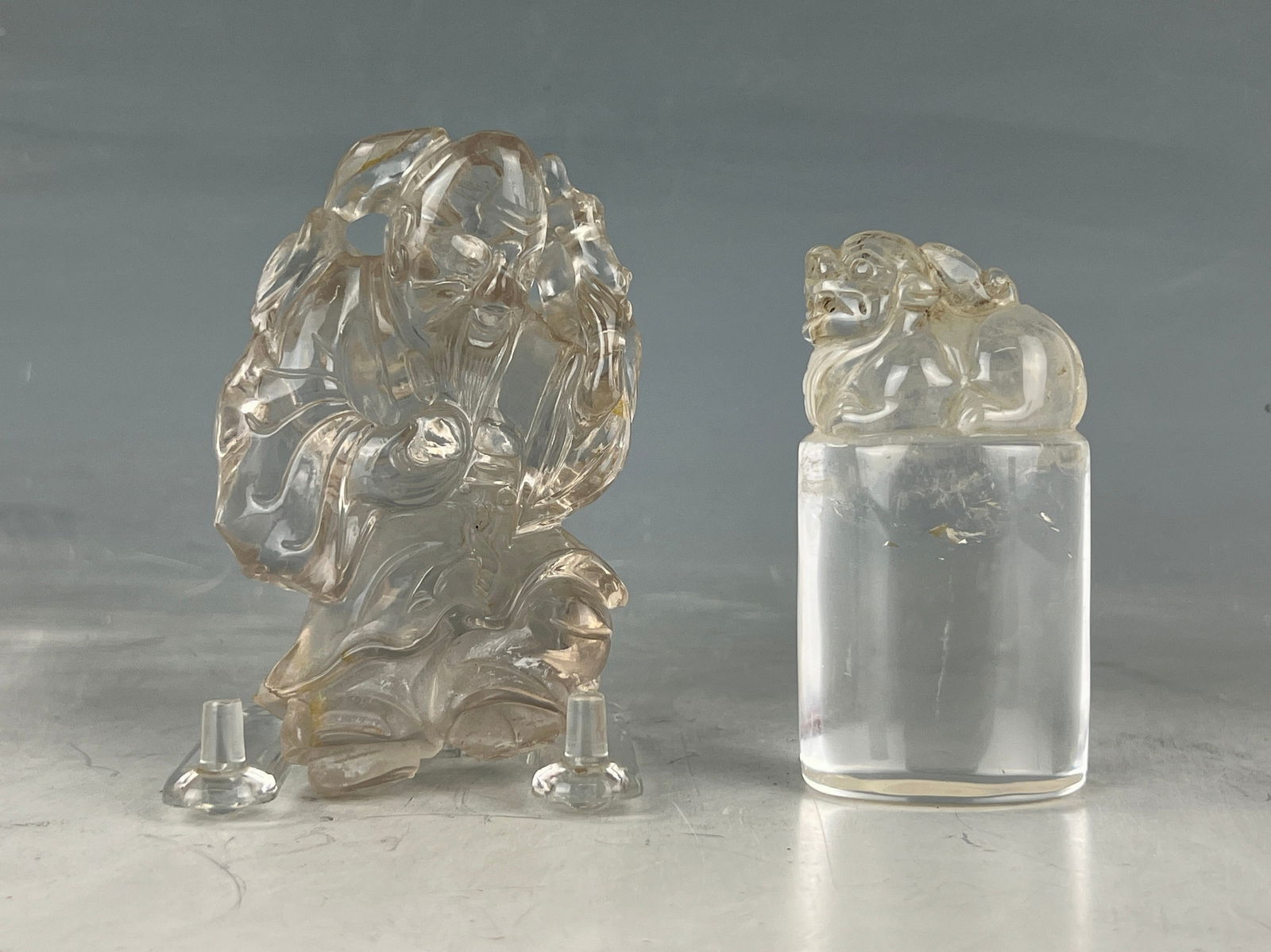 Two Pieces of Rock Crystal Carving Chop with Pixiu Finial and Statue of Longevity: Two Pieces of Rock Crystal Carving, Oval shaped Chop with Pixiu Finial and Statue of Longevity,H 10 cm(4 in.).Preview from Feb 23rd to 27th from 1:00 PM TO 5:00 PM Eastern Time, Location: 15229 Displa