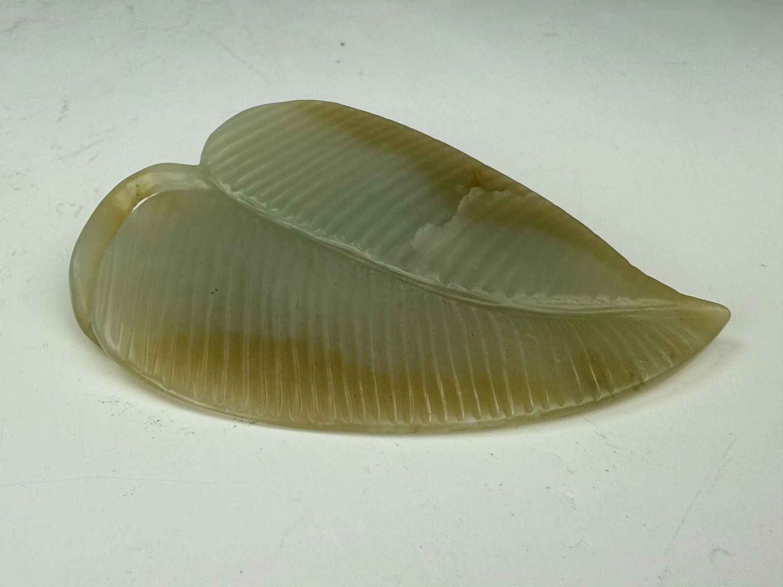 Hetian celadon jade carved leaf with a cicada in a customized box,Size 9.5 x 6.5 x 1 cm.Preview from (1 of 6)