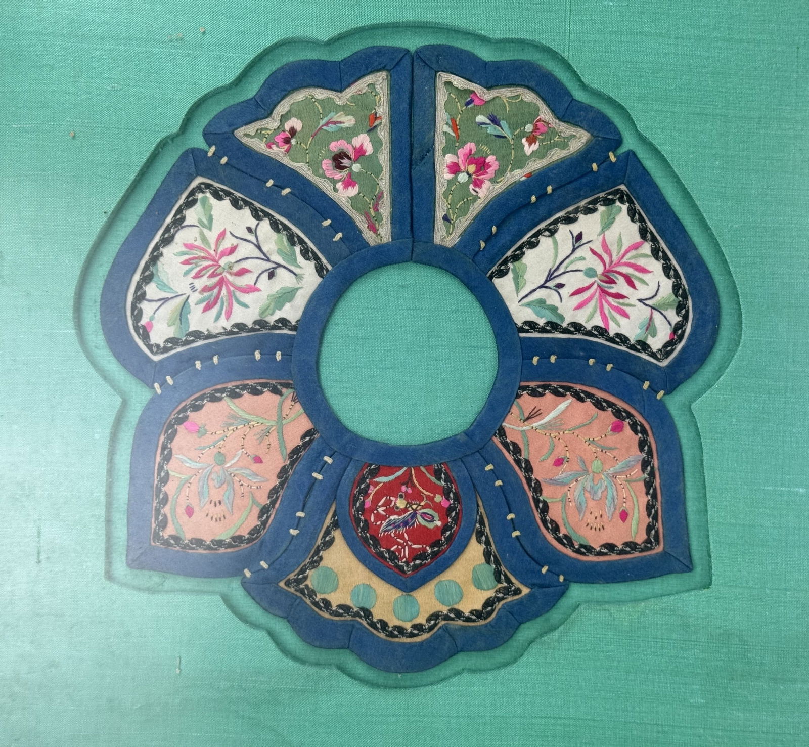 A Chinese Framed Embroidered Court Apron, 19th Century: A Chinese framed embroidered court apron, 19th century,H 36 cm(14 in.) x W 36 cm(14 in.).Preview from Feb 23rd to 27th from 1:00 PM TO 5:00 PM Eastern Time, Location: 15229 Display Court, Rockville, M