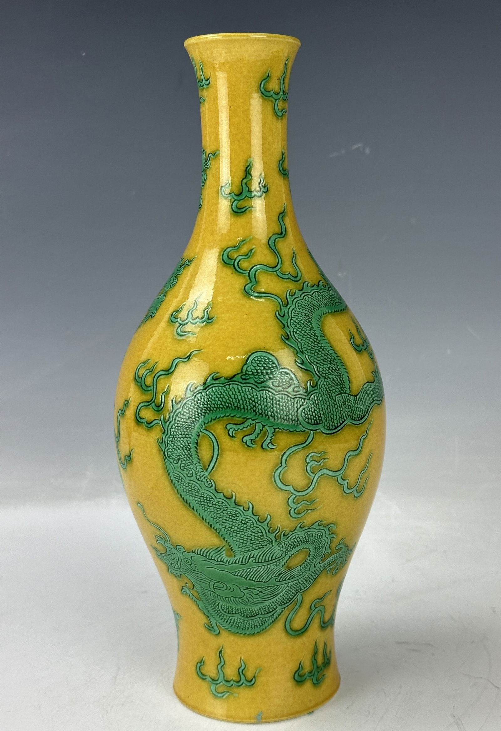 A Chinese Green Dragons Among Clouds Yellow Vase Kangxi Mark: A Chinese Green Dragons Among Clouds Yellow Porcelain Vase, Kangxi Mark,H 27 cm(11.5 in.).Preview from Feb 23rd to 27th from 1:00 PM TO 5:00 PM Eastern Time, Location: 15229 Display Court, Rockville,