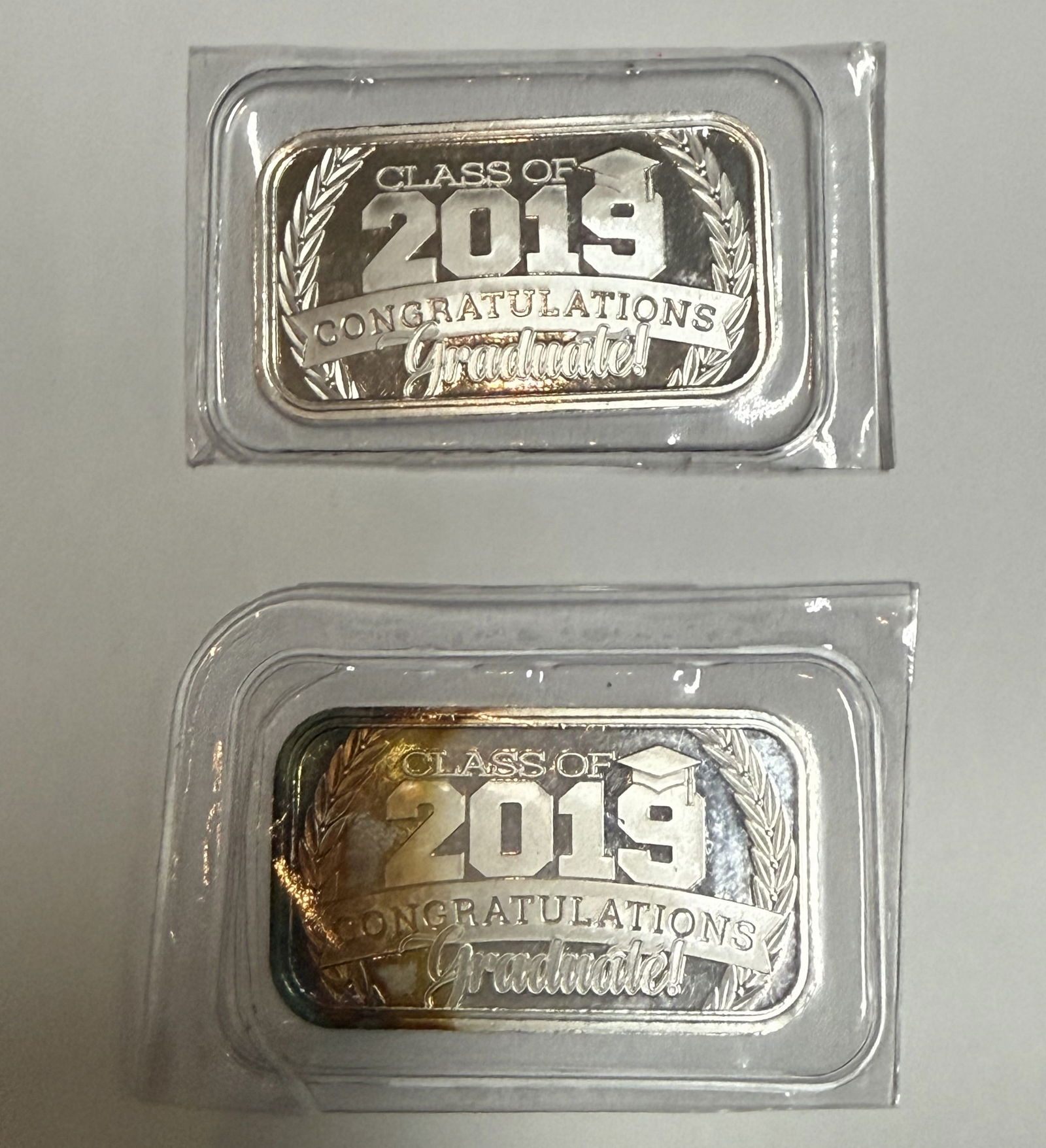 Two Class 2019 Congratulations 1oz 999 Silver Bars: Two Class 2019 Congratulations 1oz 999 Silver Bars.Preview from Feb 23rd to 27th from 1:00 PM TO 5:00 PM Eastern Time, Location: 15229 Display Court, Rockville, MD 20850.