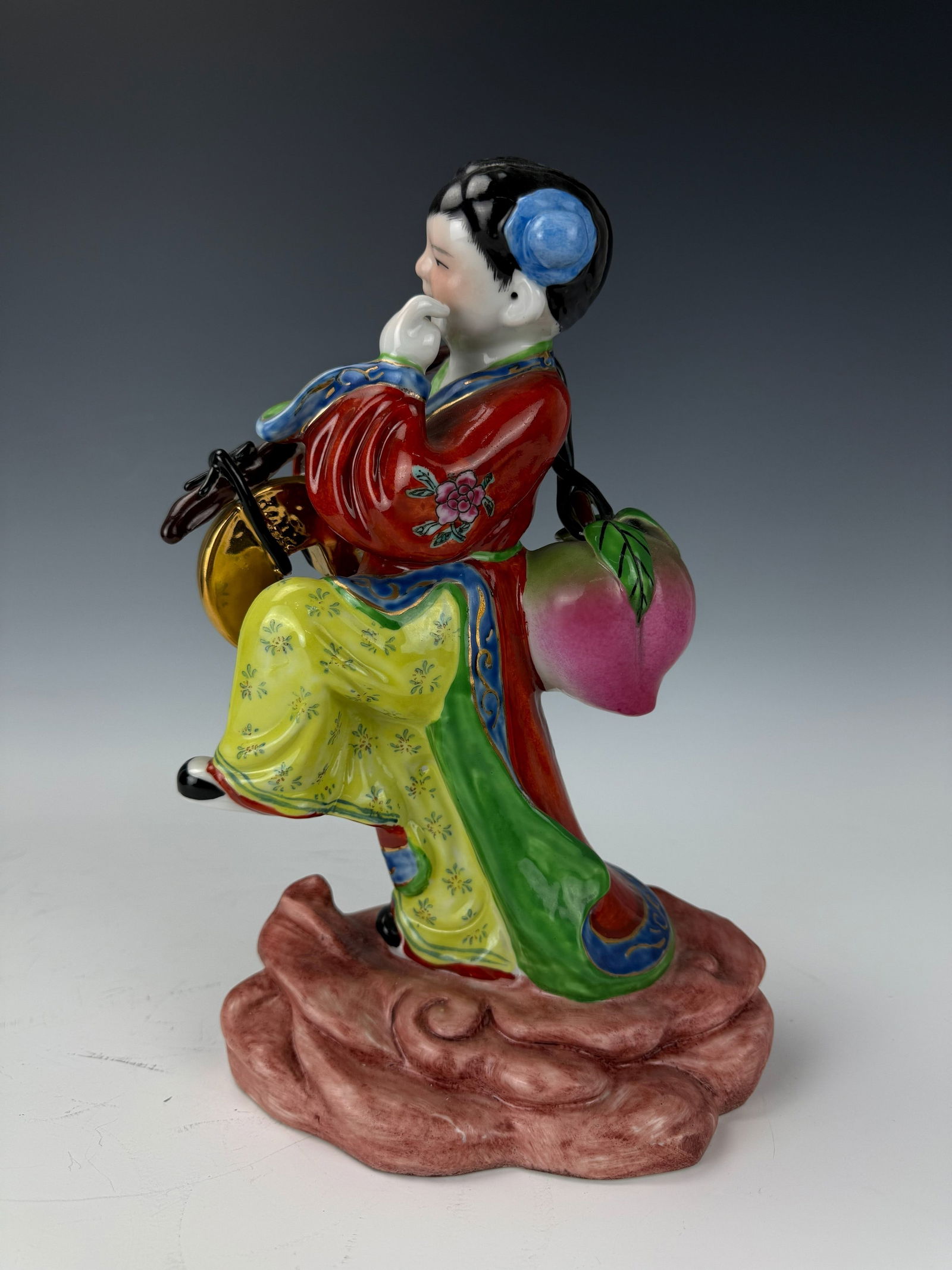 A Chinese Porcelain Figurine 20th Century: A Chinese porcelain figurine, 20th century, H 32 cm(12.5 in.).Preview from Feb 23rd to 27th from 1:00 PM TO 5:00 PM Eastern Time, Location: 15229 Display Court, Rockville, MD 20850.