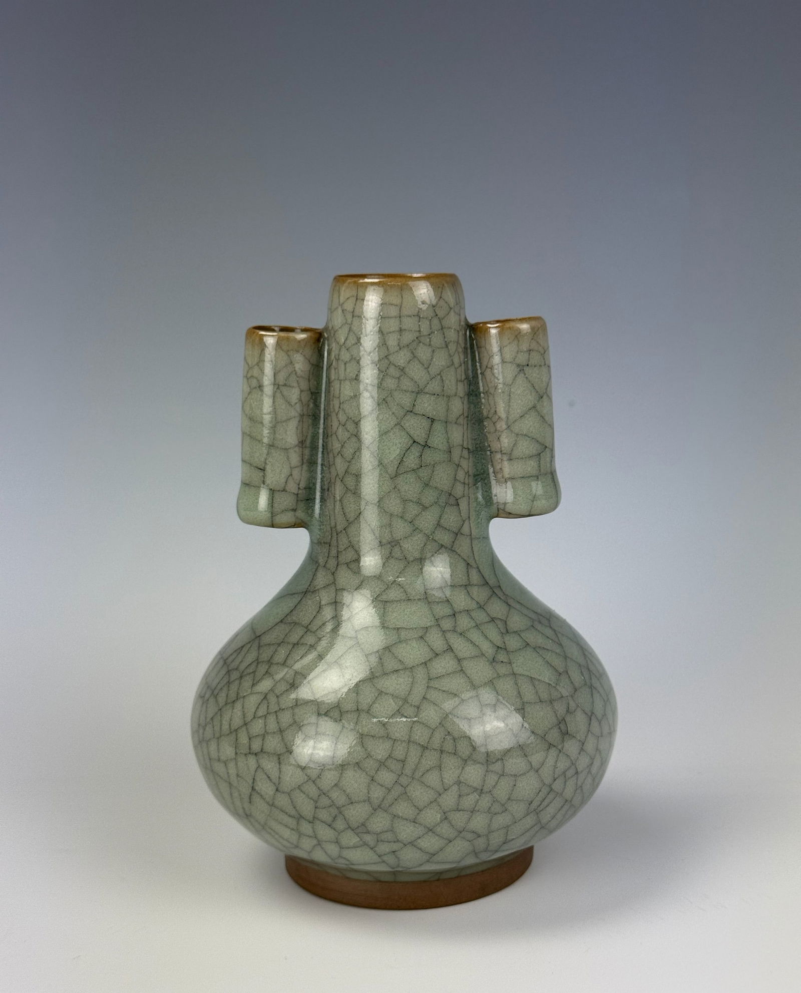 A Chinese Celadon Vase With Tubular Handles: A Chinese Celadon Vase With Tubular Handles,H 14 cm(5.5in.).Preview from Feb 23rd to 27th from 1:00 PM TO 5:00 PM Eastern Time, Location: 15229 Display Court, Rockville, MD 20850.
