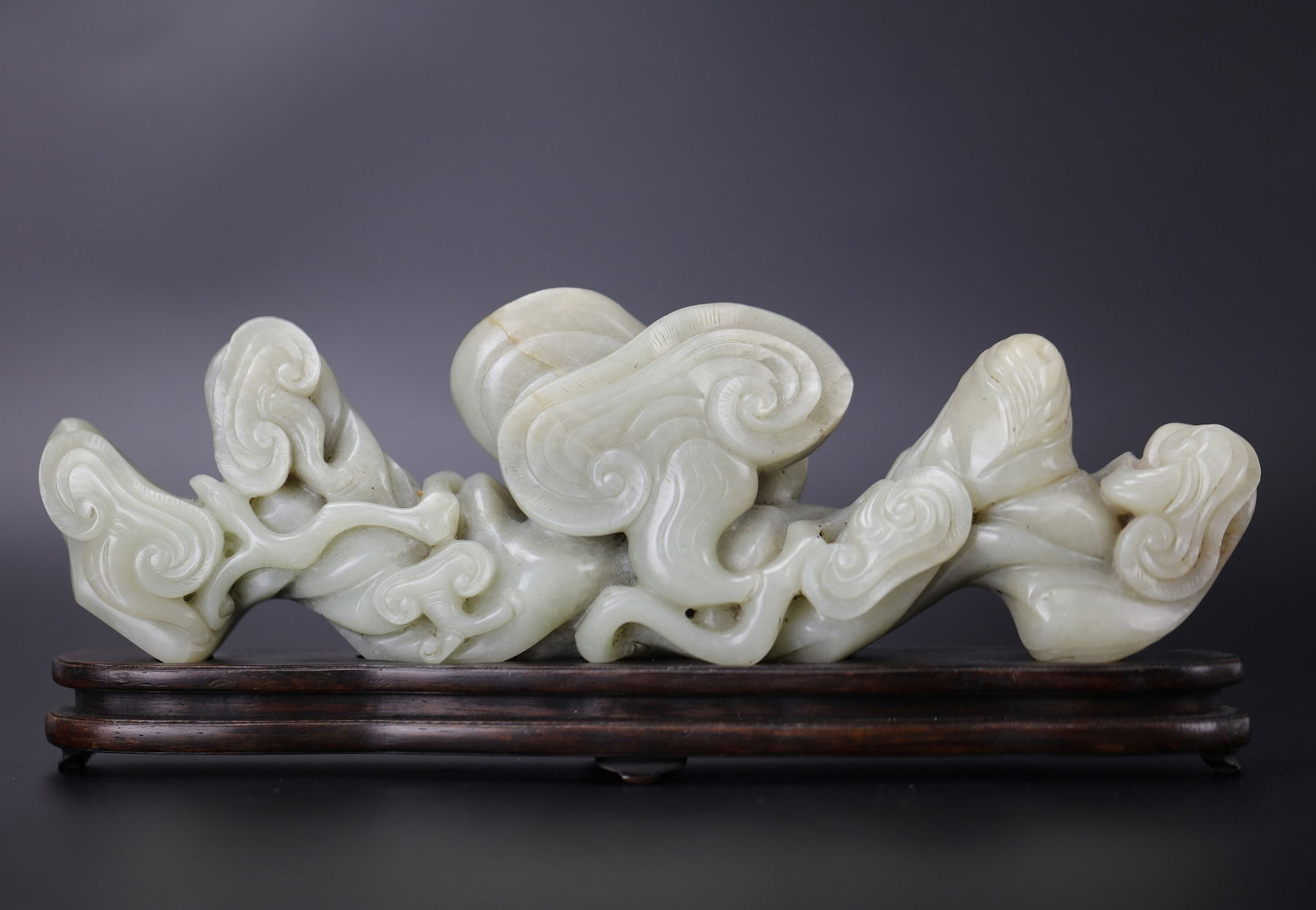 A Chinese Pen Brush Rest Carved Jade Mountain: A Chinese Pen Brush Rest Carved Jade Mountain,W 24 cm(9.5 in.) x H 10 cm(4 in.) x D 5 cm(2 in). Preview from Apr 20th to 24th from 1:00 PM TO 5:00 PM Eastern Time, Location: 15229 Display Court, Rockv