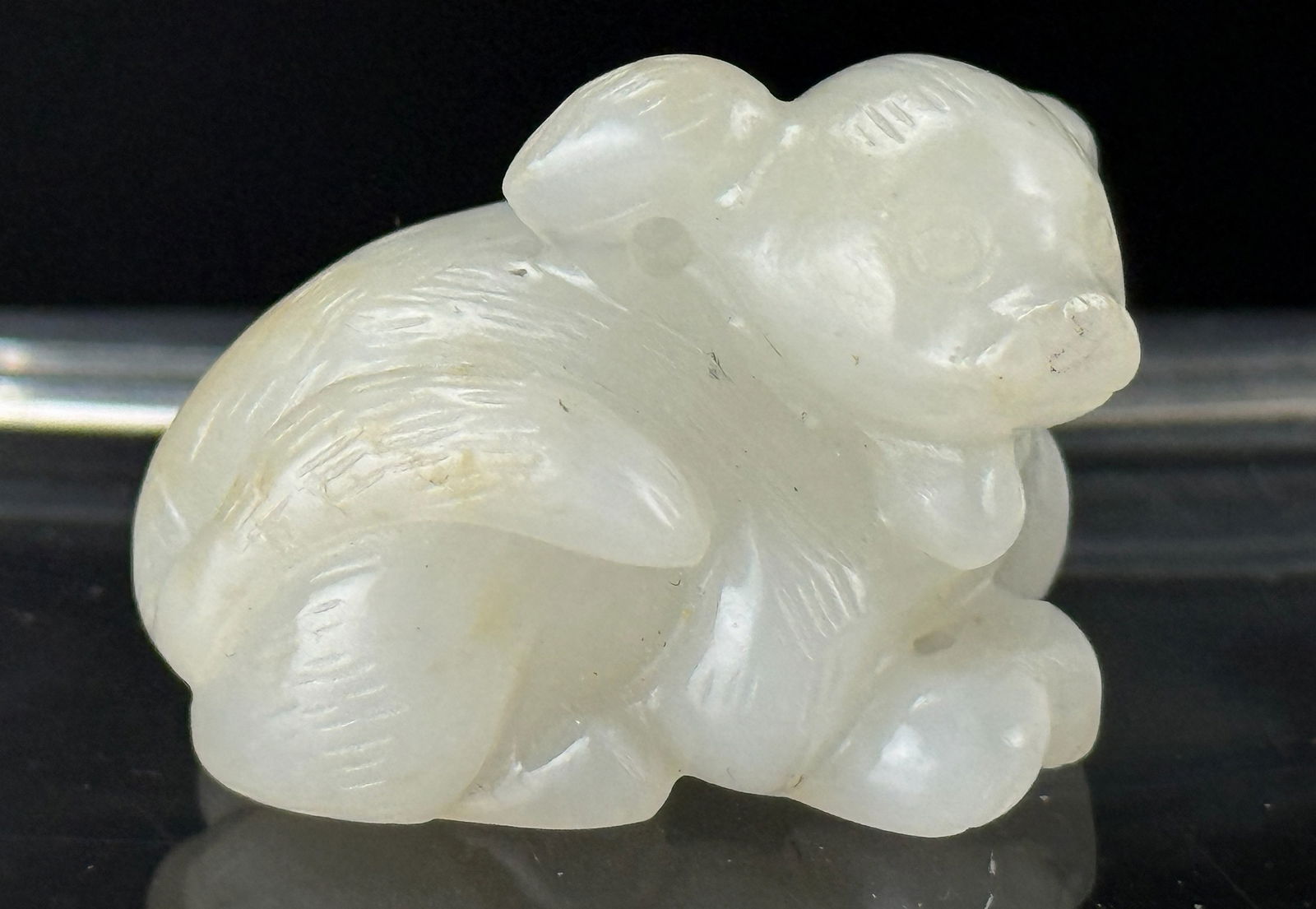 Chinese Carved Hetian White Jade Dog Statue: Chinese Carved Hetian White Jade Dog Statue.size 3 x 2.5 x 2 cm.Preview from Apr 20th to 24th from 1:00 PM TO 5:00 PM Eastern Time, Location: 15229 Display Court, Rockville, MD 20850.