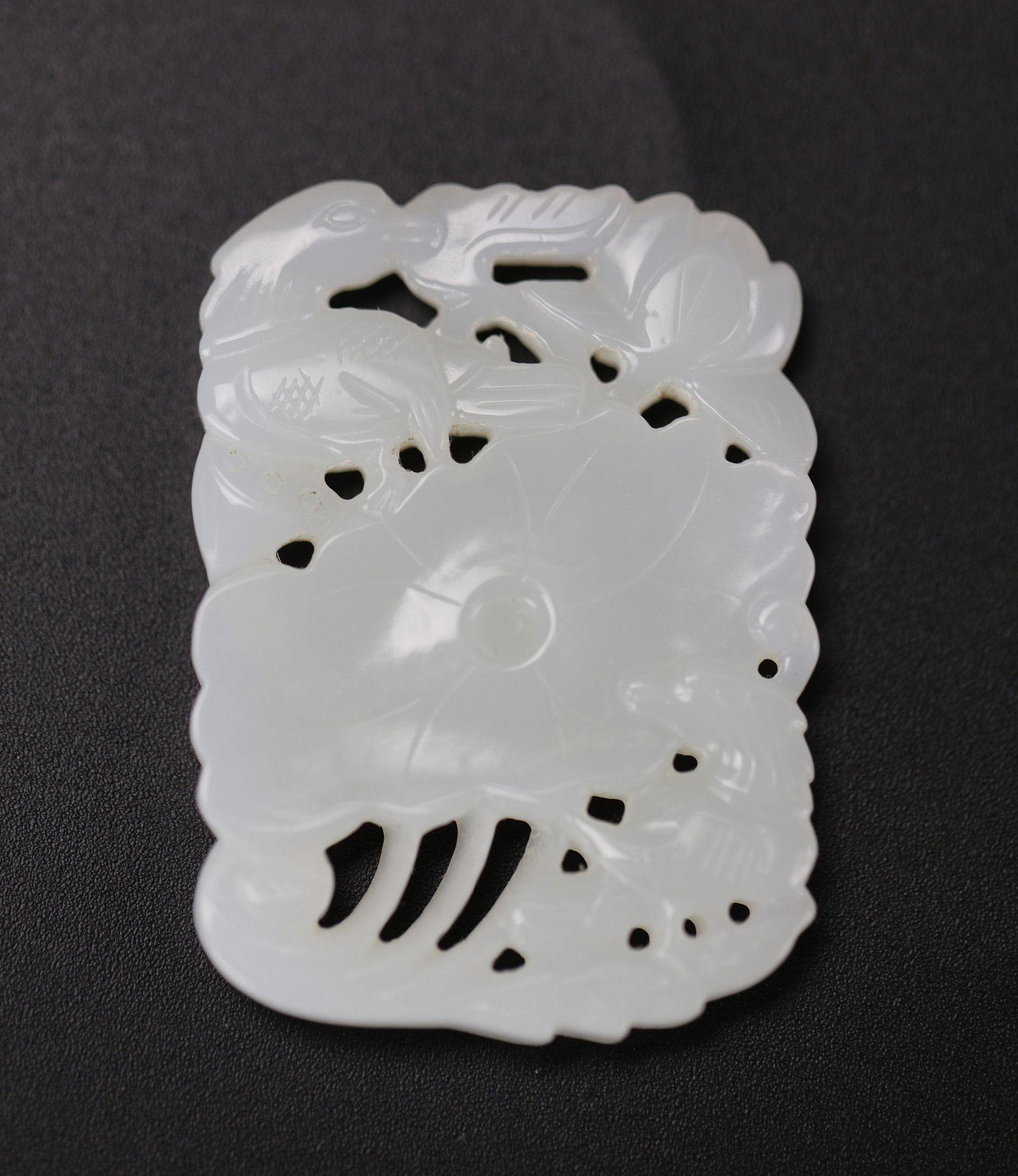 Chinese White Jade Pendant Carved with Mandarin Ducks and Lotus: A Chinese Hetian White Jade Pendant Carved with Mandarin Ducks and Lotus,size 5.5 x 4 cm. Preview from Apr 20th to 24th from 1:00 PM TO 5:00 PM Eastern Time, Location: 15229 Display Court, Rockville,