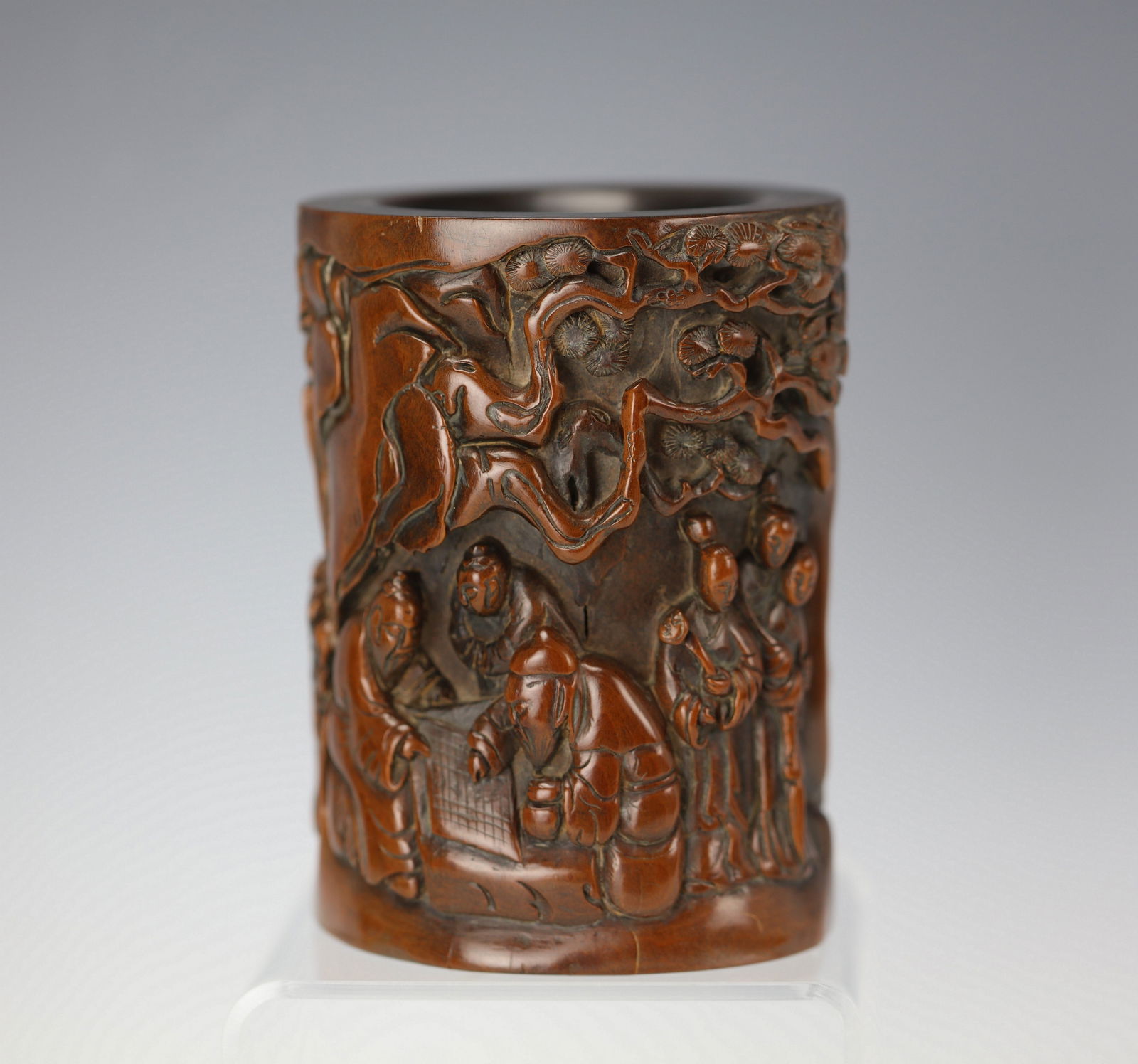 Chinese Boxwood Brush Pot with Deep Relief Carving of Figurines: Huangyang Boxwood brush pot with deep relief carving of figurines, H 12.7 cm(5 in.) x W 3.7 cm(9.6 in.).Preview from Apr 20th to 24th from 1:00 PM TO 5:00 PM Eastern Time, Location: 15229 Display Cour