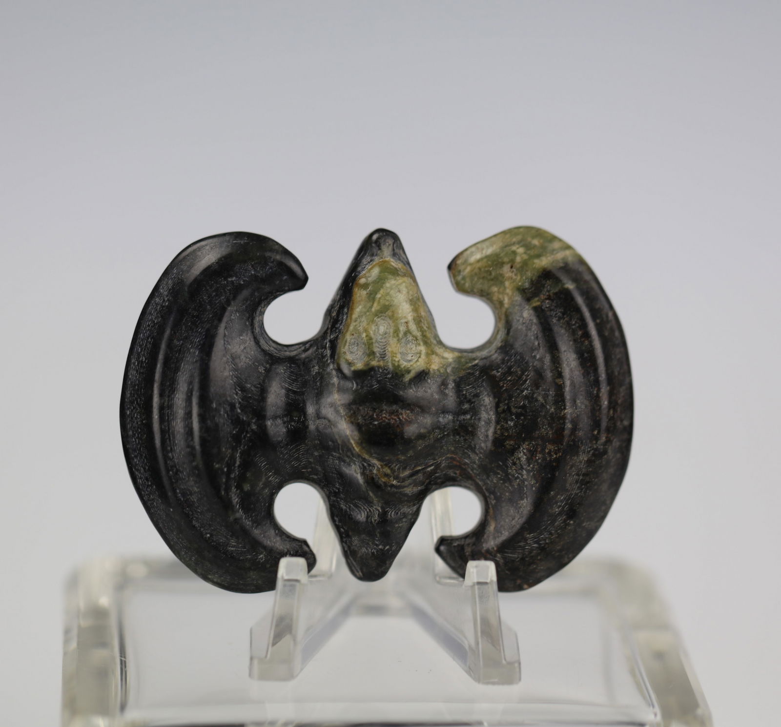Celadon Jade with Black Calcification Pendant Carved Bat: Celadon jade with black calcification pendant carved in the shape of a bat, size 7 x 5.2 cm.Preview from Apr 20th to 24th from 1:00 PM TO 5:00 PM Eastern Time, Location: 15229 Display Court, Rockville