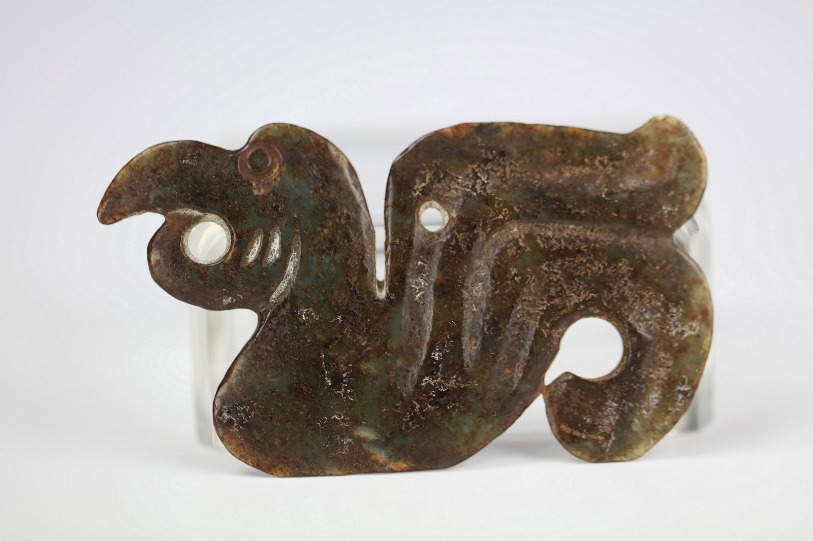 A Chinese Carved Goose Jade Pendant: Celadon Jade carved pendant with the shape of goose, size 10 x 5.8 cm.Preview from Apr 20th to 24th from 1:00 PM TO 5:00 PM Eastern Time, Location: 15229 Display Court, Rockville, MD 20850.