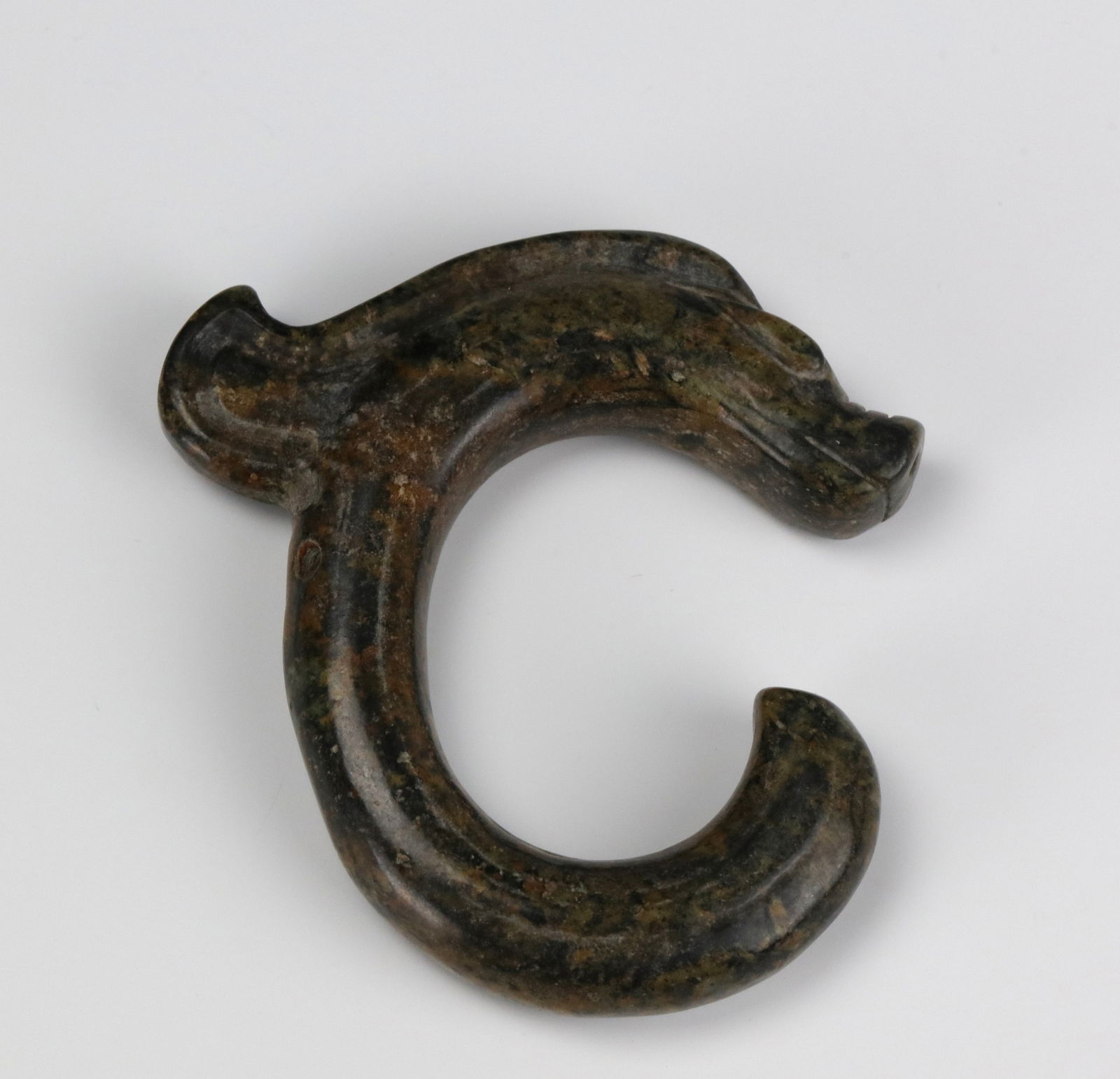 Chinese Celadon Jade Carved C Dragon Pendant: Chinese Celadon Jade Carved C Shape Dragon Pendant, size 7 x 6.5x 1 cm.Preview from Apr 20th to 24th from 1:00 PM TO 5:00 PM Eastern Time, Location: 15229 Display Court, Rockville, MD 20850.