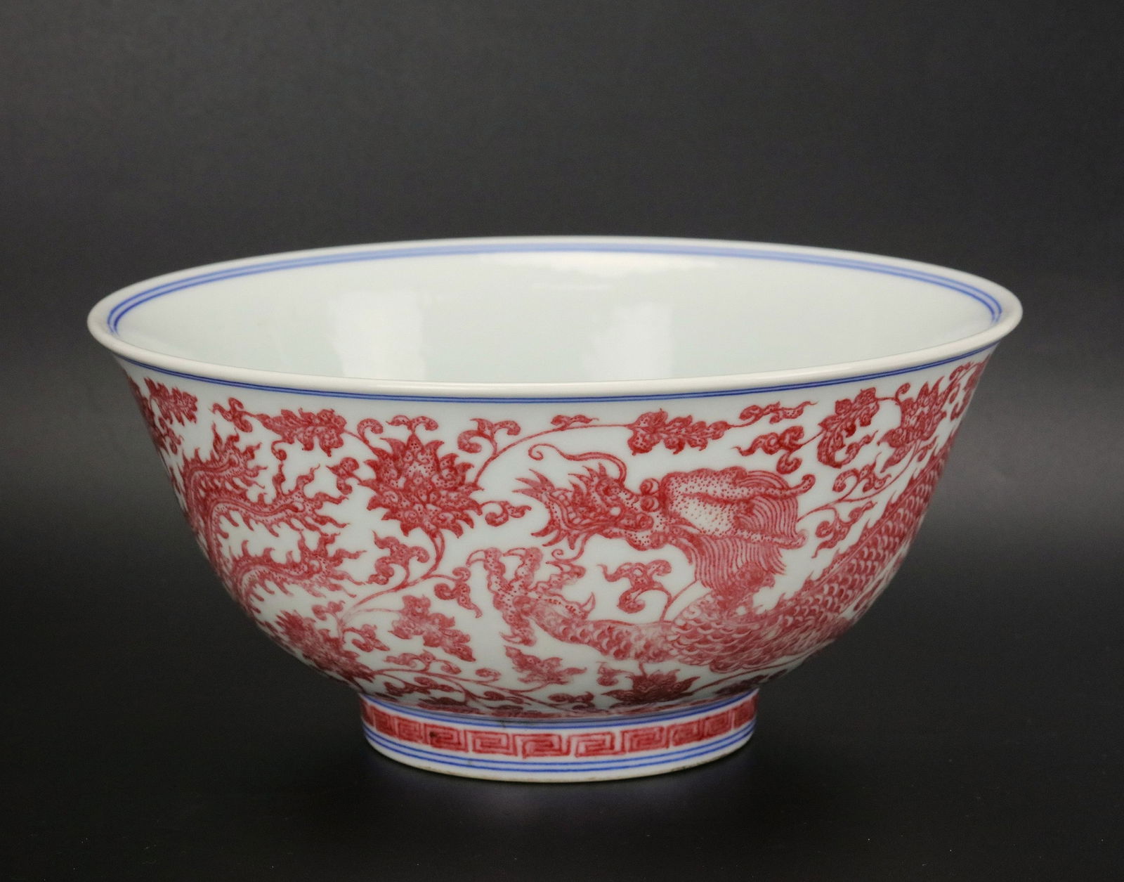 Chinese Blue & White and Under Glazed Red Dragon Porcelain Bowl: Large bowl with blue & white and under-glazed copper decoration of dragon among flowers,D 20 cm(8 in.) x H 9.6 cm(3.8 in.).Preview from Apr 20th to 24th from 1:00 PM TO 5:00 PM Eastern Time, Location: