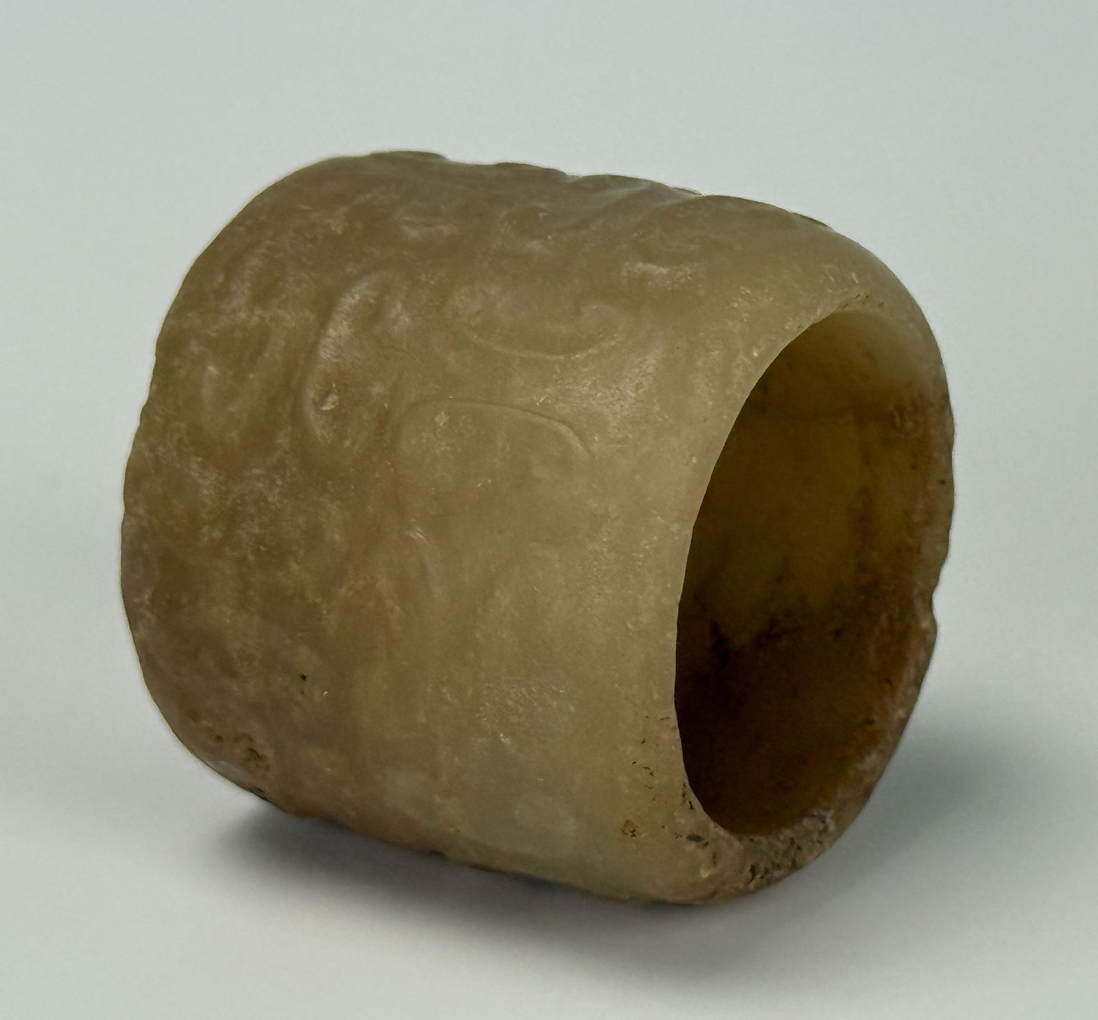 Celadon Jade Carved Archer Ring with Cloud Pattern: Celadon Jade carved archer ring with cloud pattern,size 2.5 x 2.2 cm,Preview from Apr 20th to 24th from 1:00 PM TO 5:00 PM Eastern Time, Location: 15229 Display Court, Rockville, MD 20850.