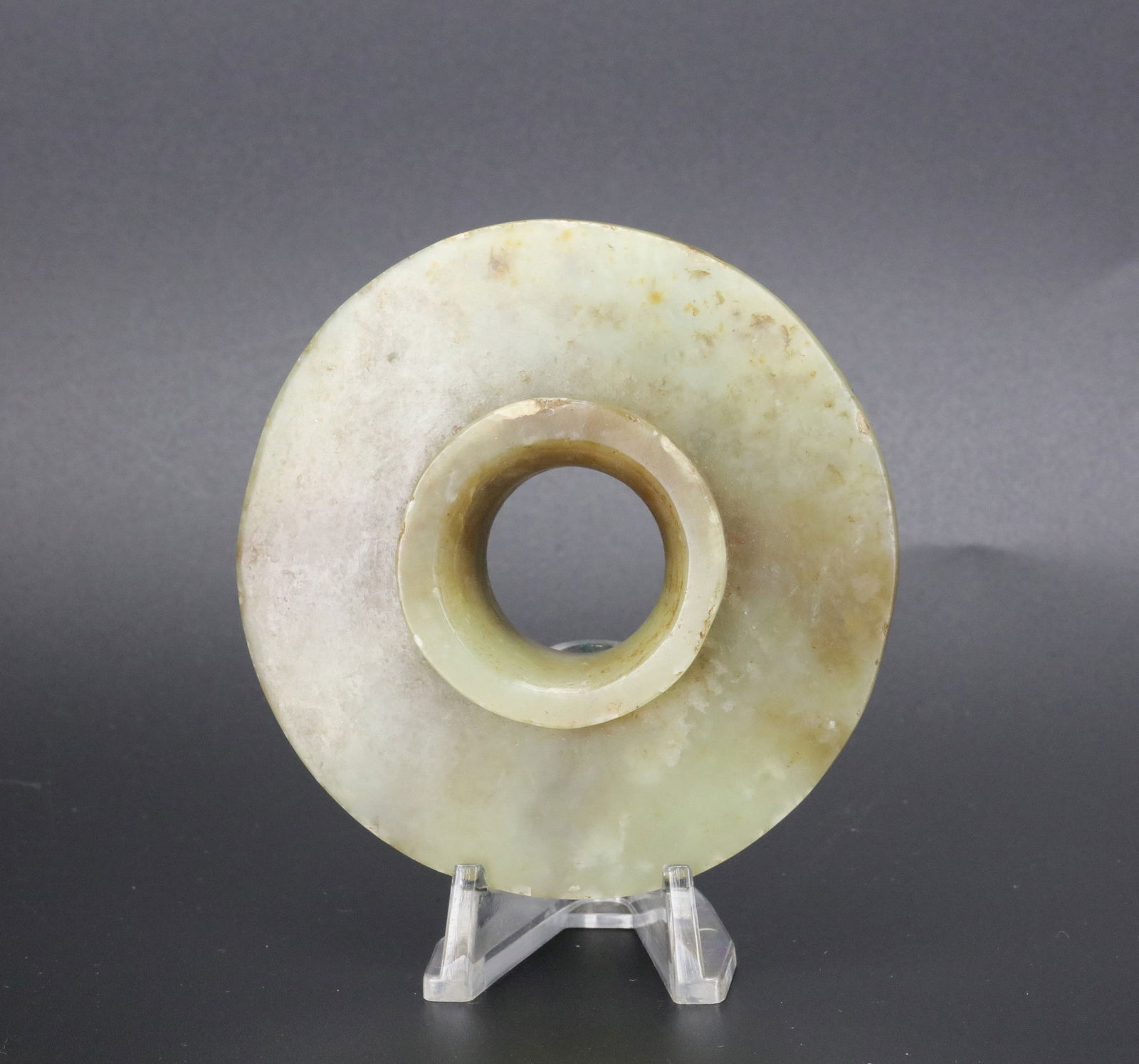 Celadon Jade Carved Bi disc With Flared Lips: Celadon Jade carved Bi disc with flared lips, size 8.3 x 2.5 cm .Preview from Apr 20th to 24th from 1:00 PM TO 5:00 PM Eastern Time, Location: 15229 Display Court, Rockville, MD 20850.