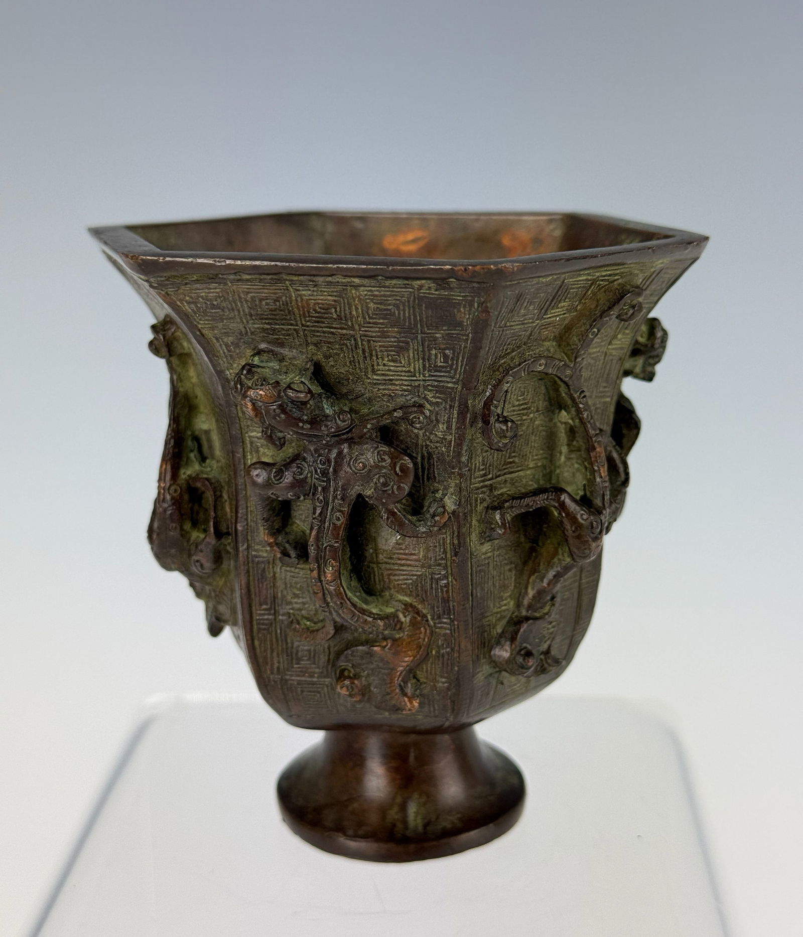 Chinese Bronze Cup with High Relief Carving of Dragons: Bronze cup with high - relief carving of dragons, H8.9cm (3.5in) x D9.7cm(3.8in). Preview from Apr 20th to 24th from 1:00 PM TO 5:00 PM Eastern Time, Location: 15229 Display Court, Rockville, MD 20850