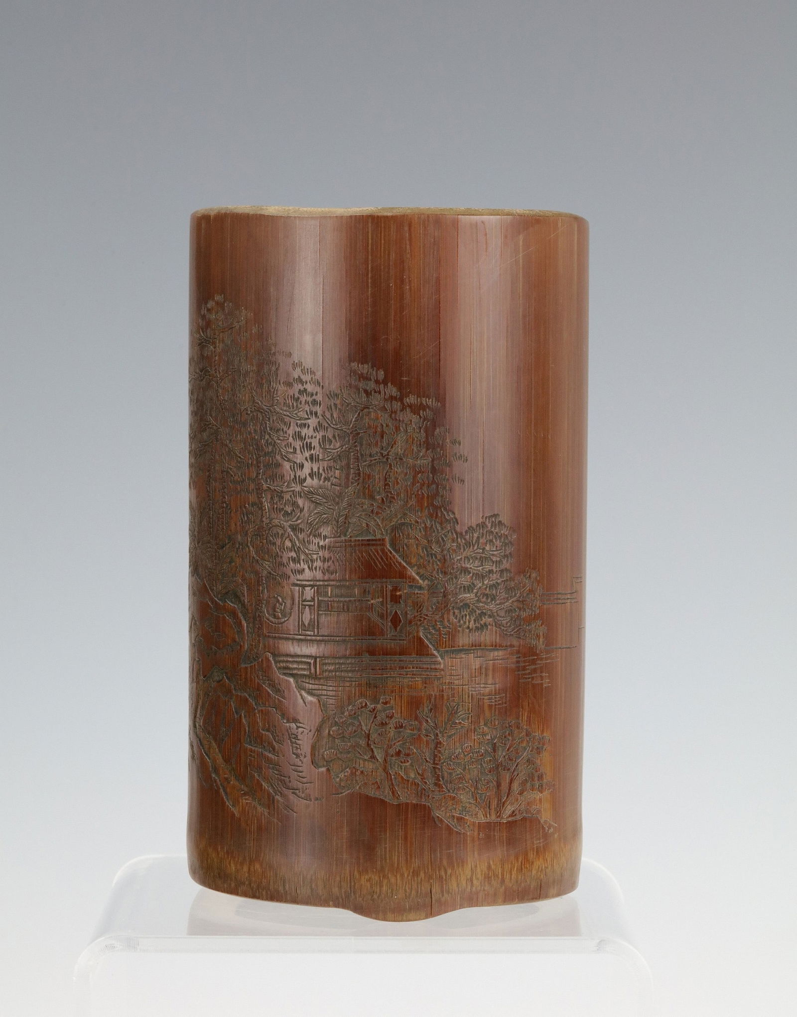 A Carved Landscape and Chinese Calligraphy Bamboo Brush Pot: A Carved Landscape and Chinese Calligraphy Bamboo Brush Pot, H 15 cm (6 in) x D 11 cm (4.3 in). Preview from Apr 20th to 24th from 1:00 PM TO 5:00 PM Eastern Time, Location: 15229 Display Court, Rockv