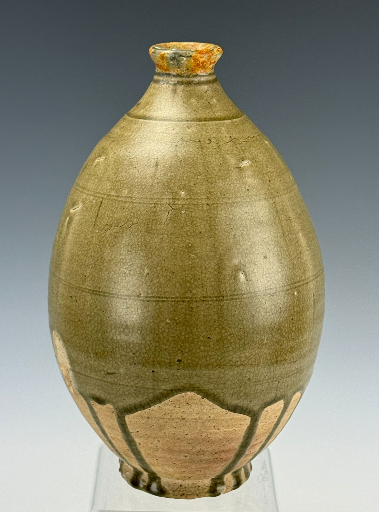 Chinese Sui Dynasty Olive Green Glazed Stoneware Jar: An olive green-glazed stoneware jar, Sui dynasty (581 - 618),H 21 cm (8.3 in). Preview from Apr 20th to 24th from 1:00 PM TO 5:00 PM Eastern Time, Location: 15229 Display Court, Rockville, MD 20850.
