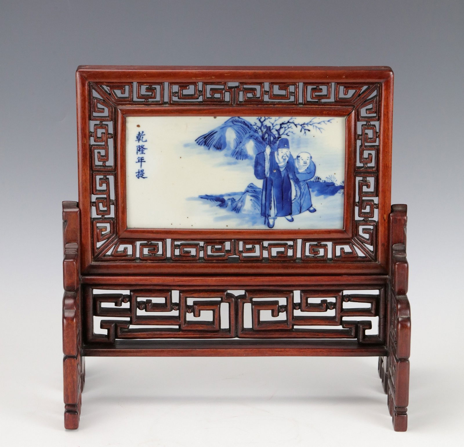 A Chinese Table Screen With Blue and White Porcelain Panel: A Chinese Table Screen with Hand-Painted Blue and White Porcelain Panel. H 34 cm(13.5in) x W 33 cm (12.7in) x D 18 cm (7in). Preview from Apr 20th to 24th from 1:00 PM TO 5:00 PM Eastern Time, Locatio