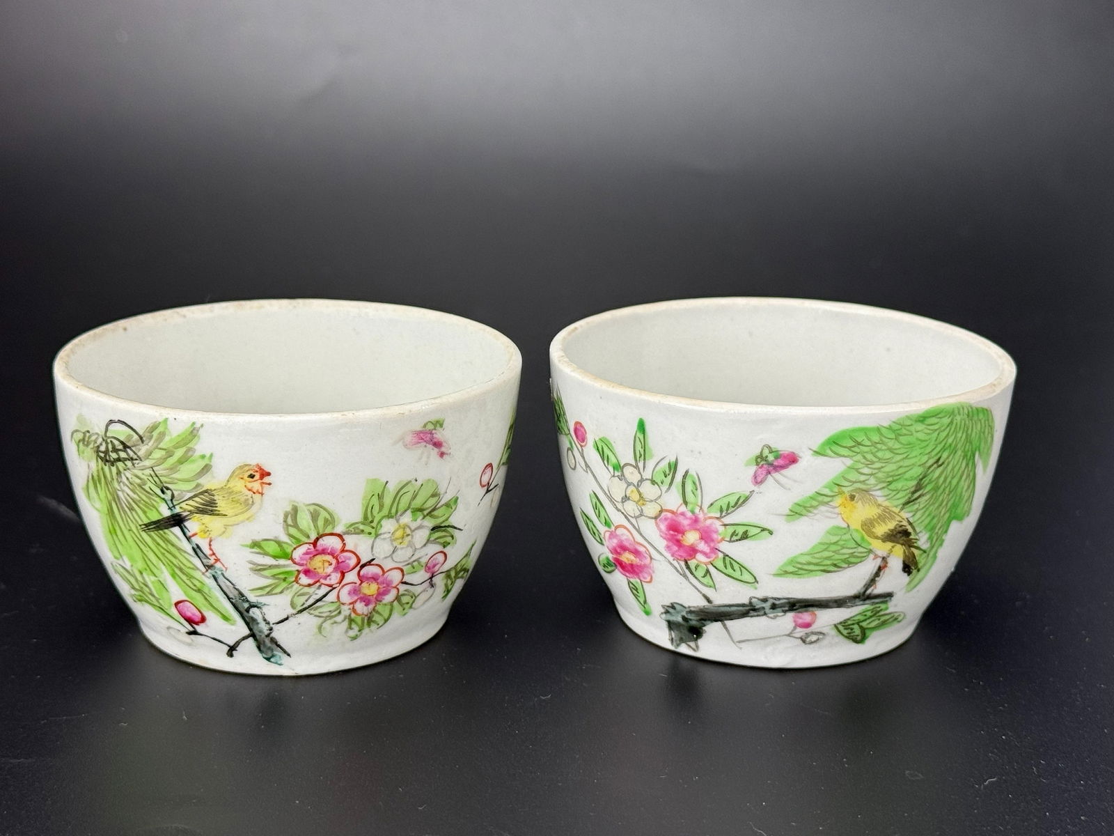 Two Porcelain Cups with Hand Painted Flower and Bird Design: Two Porcelain Cups with Hand-painted Flower and Bird Design ,D 8 cm (8.3in) x H 5 cm (2in) x 2. Preview from Apr 20th to 24th from 1:00 PM TO 5:00 PM Eastern Time, Location: 15229 Display Court, Rockv