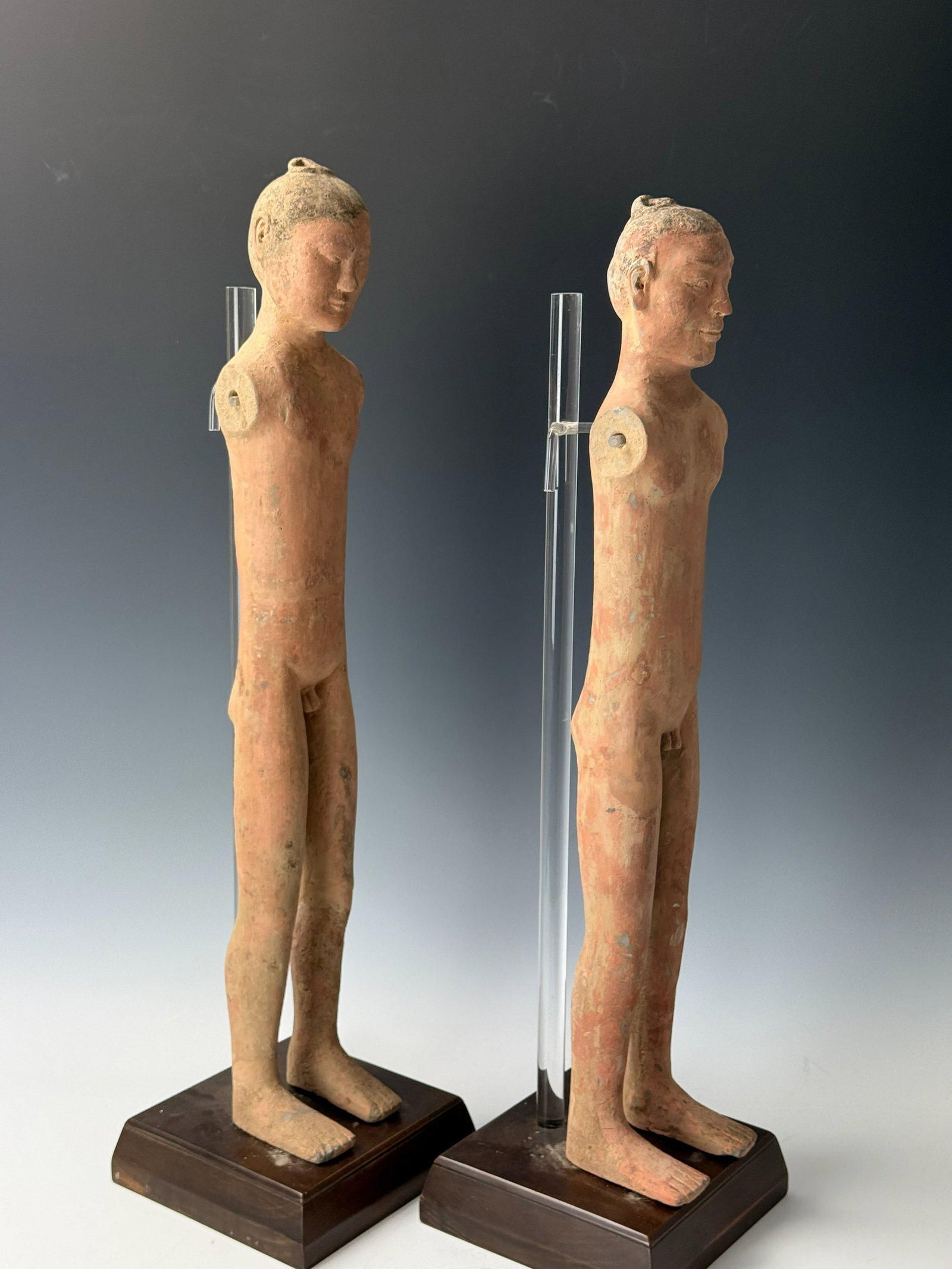 Two Standing Chinese Han Dynasty Terracotta Male Stick Figures: Two Standing Chinese Han Dynasty Terracotta Male Stick Figures, H 63 cm (25 in). Provenance from Dr. Constantine collection, Acquired directly from TK Asian Antiquities.Preview from Apr 20th to 24th f