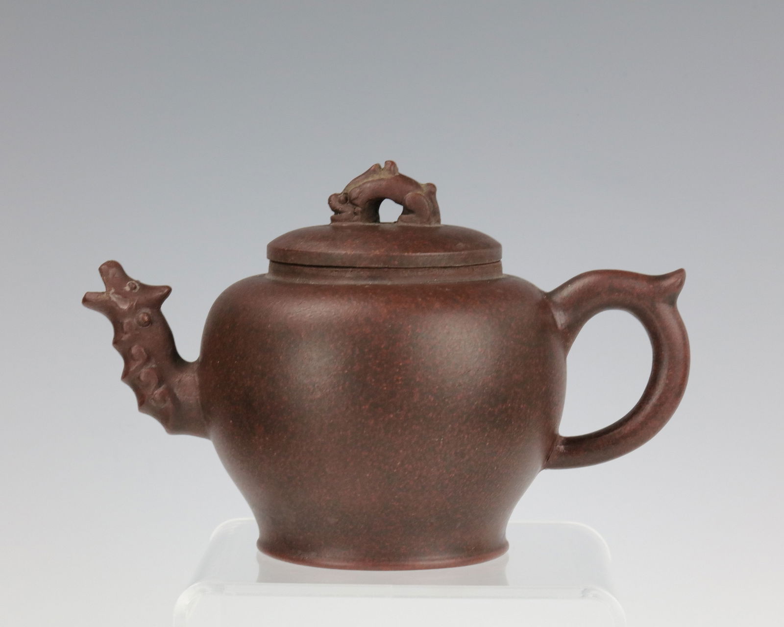 Yixing Zisha Teapot with Dragon Handle and Mouth Wang Yinchun Mark: Yixing Zisha teapot with dragon handle and mouth. Wang Yinchun Signature seal , W 15.2 cm (6 in) x H10.2 cm (4in). Preview from Apr 20th to 24th from 1:00 PM TO 5:00 PM Eastern Time, Location: 15229 D