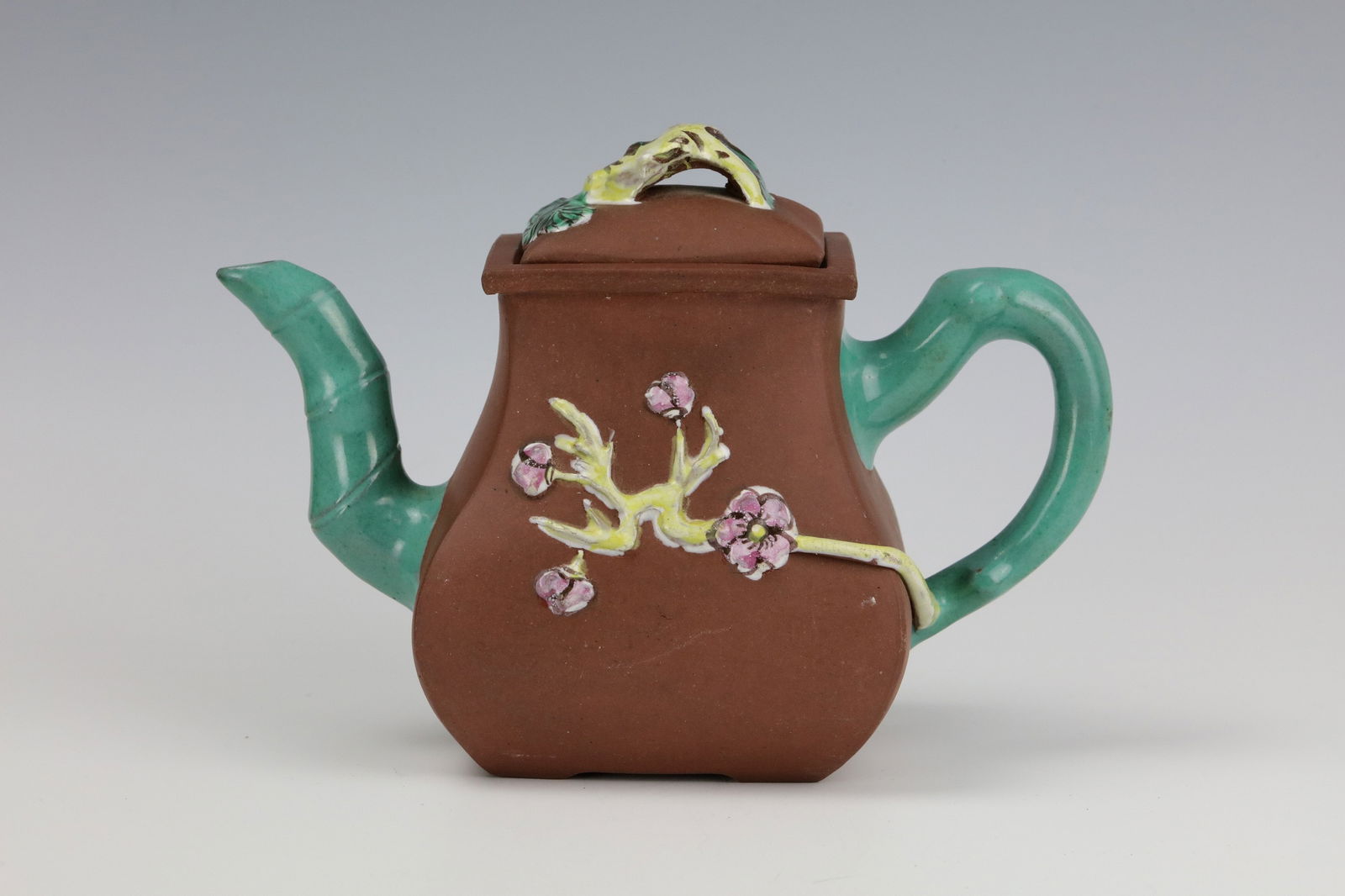 Yixing Zisha Teapot with Famille Rose Glaze of Flower and Bamboo: Yixing Zisha Teapot with Famille Rose Glaze of Flower and Bamboo, Marked. W 19 cm (7.5in) x H 14cm (5.5 in)x D 8 cm (3 in). Preview from Apr 20th to 24th from 1:00 PM TO 5:00 PM Eastern Time, Location