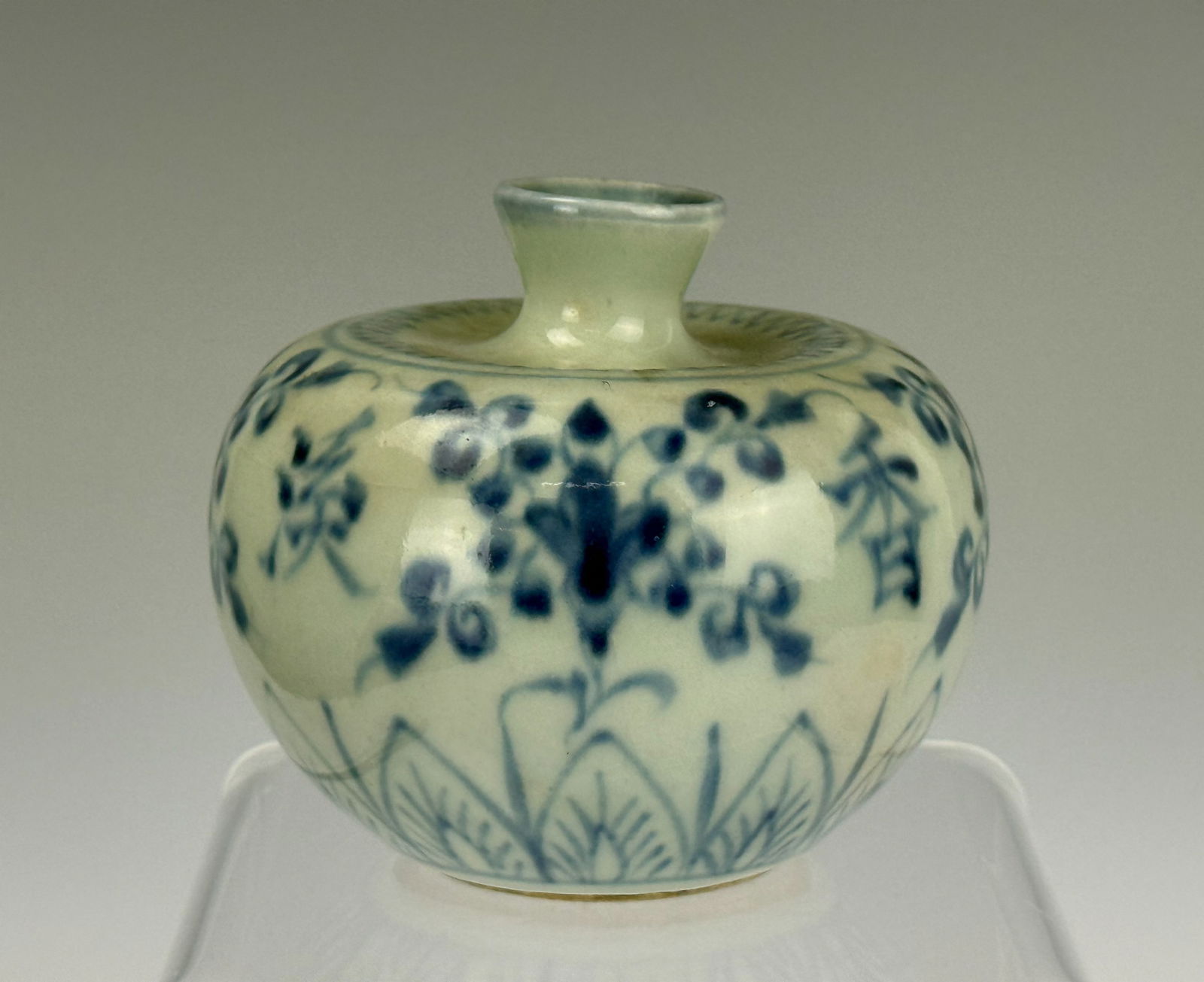 Chinese Blue and White Apple Shaped Water Porcelain Pot: Blue & White glazed apple- shaped water pot with banana leaves and flowers, D 10 (4in) x H 7.6 cm(3in). Preview from Apr 20th to 24th from 1:00 PM TO 5:00 PM Eastern Time, Location: 15229 Display Cour