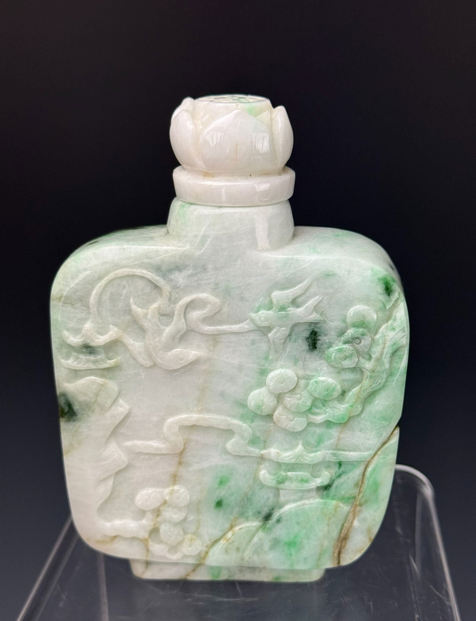 A Large Chinese Green Jadeite Snuff Bottle: A Large Chinese Green Jadeite Snuff Bottle, size 12 x 8 x 3 cm. Preview from Apr 20th to 24th from 1:00 PM TO 5:00 PM Eastern Time, Location: 15229 Display Court, Rockville, MD 20850.