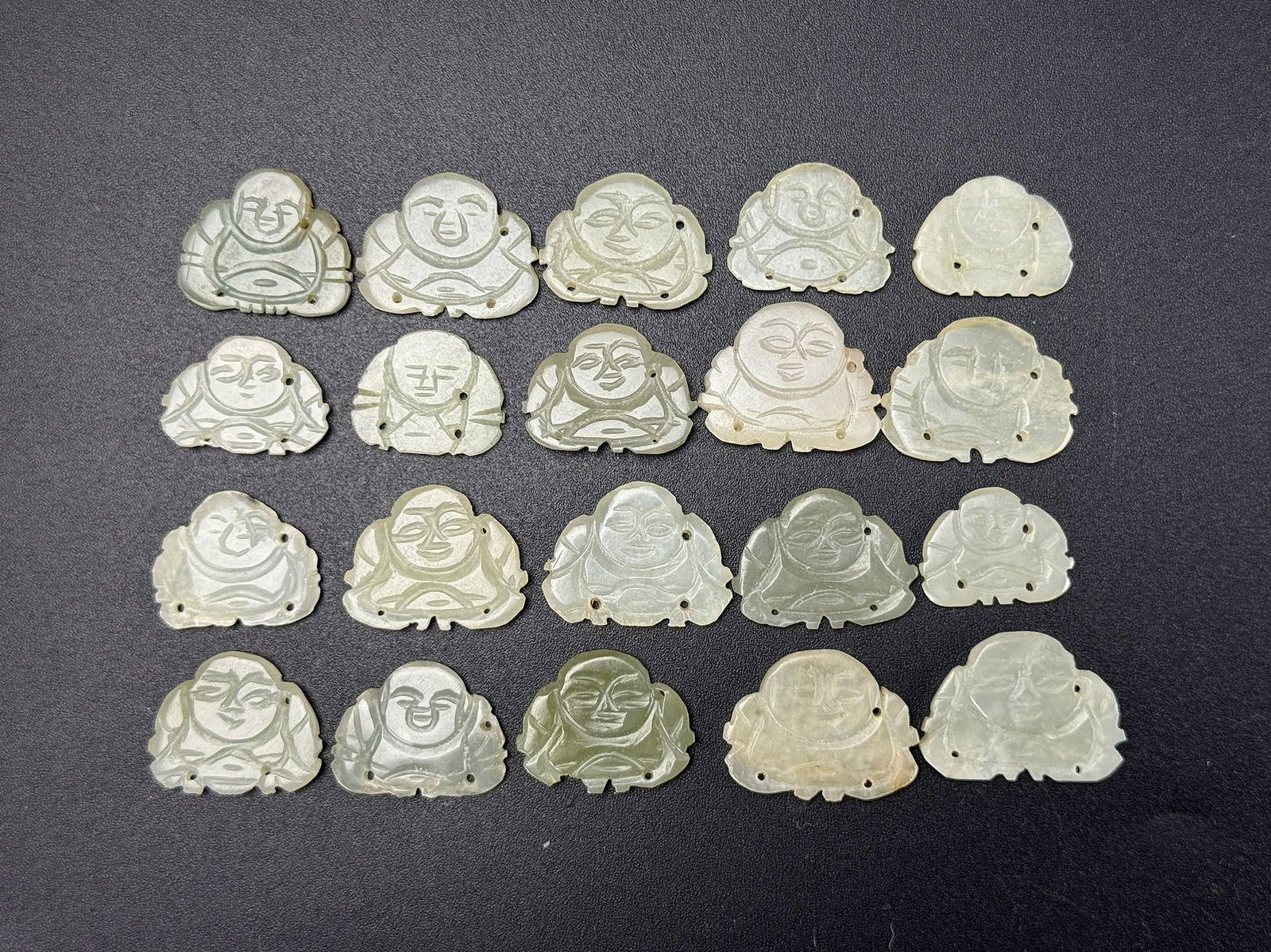 Group of 20 Small ChineseCarved Jade Laughing Buddha Pendants: Group of 20 Small ChineseCarved Jade Laughing Buddha Pendants, size 3 x 2 cm.Preview from Apr 20th to 24th from 1:00 PM TO 5:00 PM Eastern Time, Location: 15229 Display Court, Rockville, MD 20850.