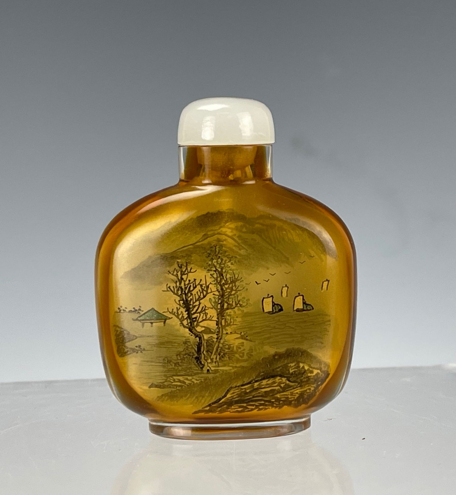 Chinese Inside Painting Peking Glass Snuff Bottle: Chinese snuff bottle made of amber-colored glass, featuring delicate inside painting of a landscape scene,H 5 cm(2 in).Preview from Apr 20th to 24th from 1:00 PM TO 5:00 PM Eastern Time, Location: 152
