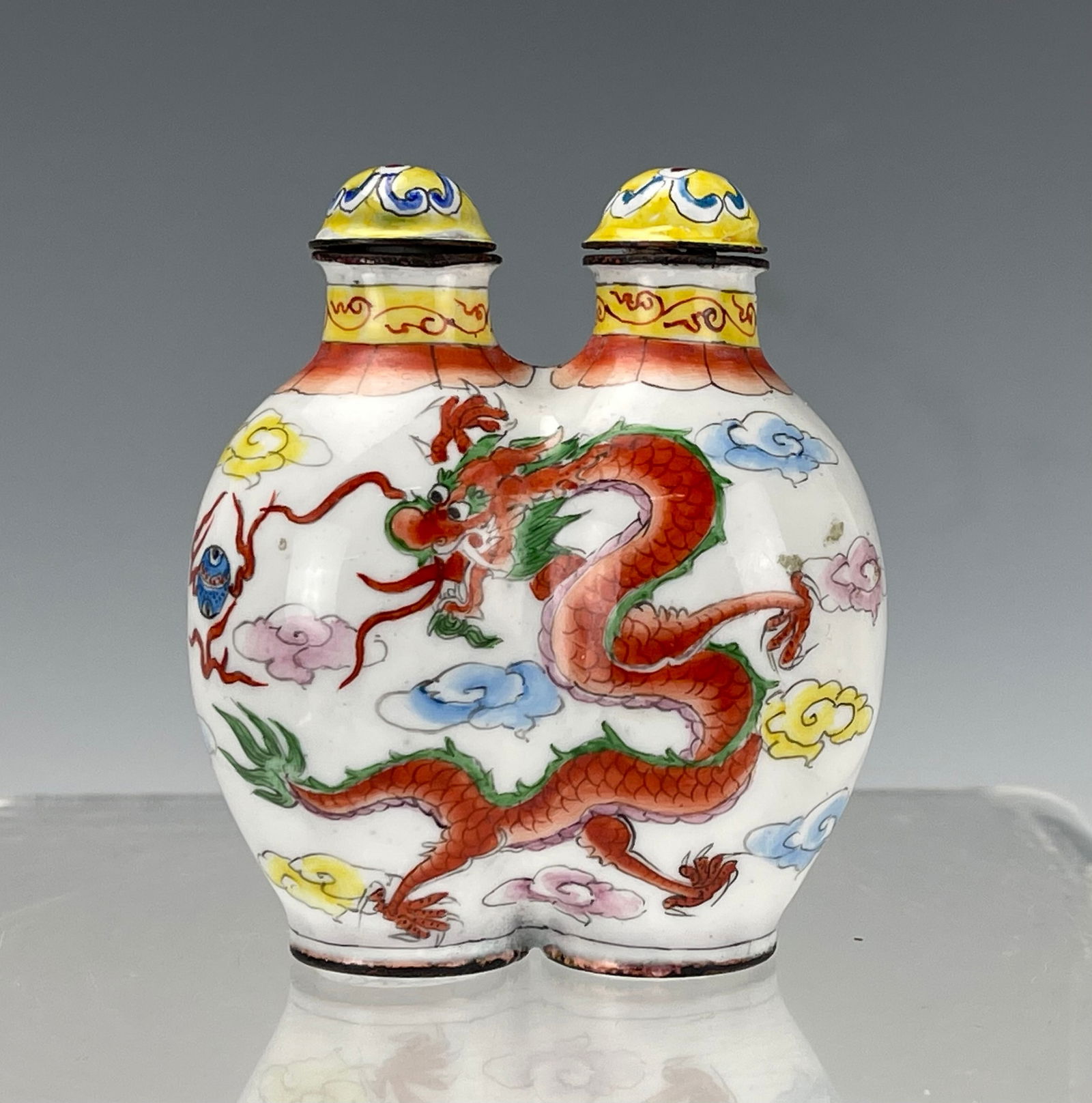 A Chinese Enamel Conjoined Twin Dragon Snuff Bottle: A Chinese Enamel Conjoined Twin Dragon Snuff Bottle, szie 7 x6 x 4 cm.Preview from Apr 20th to 24th from 1:00 PM TO 5:00 PM Eastern Time, Location: 15229 Display Court, Rockville, MD 20850.