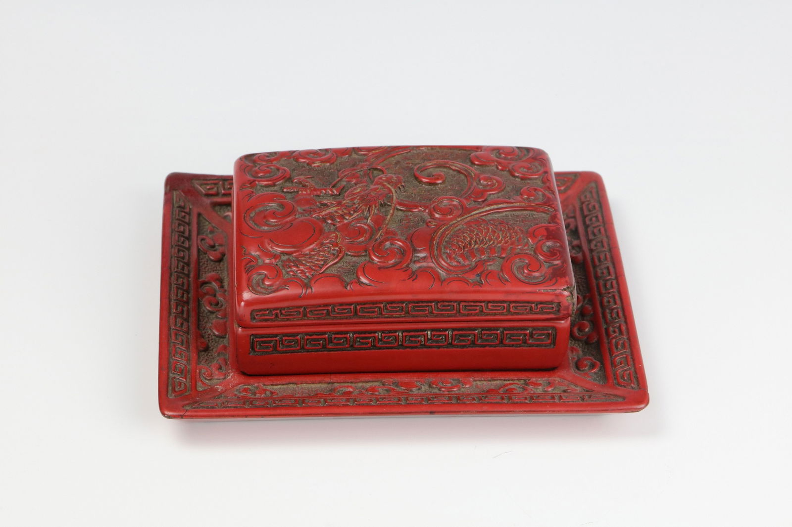 A Chinese Carved red Cinnabar Lacquer Box and A Tray: A Chinese Carved red Cinnabar Lacquer Box and A Tray, Box size 12 x 9 x 4.3 cm,Tray size W 17 cm( 6.7 in.) x D 14.5 cm( 5.6 in.).Preview from Apr 20th to 24th from 1:00 PM TO 5:00 PM Eastern Time, Loc