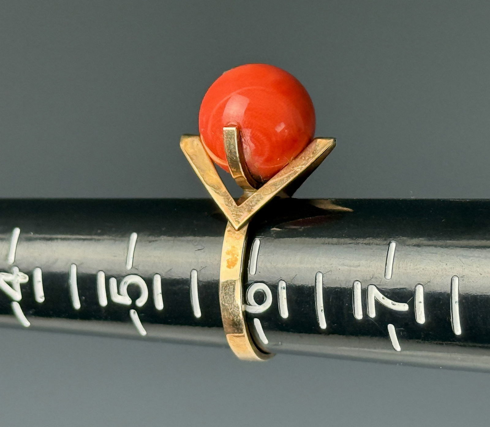 Vintage 18K Gold Cabochon Red Coral Ring: This vintage Art Deco cocktail ring features a natural red coral sphere cabochon set in a delicate 18K yellow gold frame,total 3.8 grams.Preview from Apr 20th to 24th from 1:00 PM TO 5:00 PM Eastern T