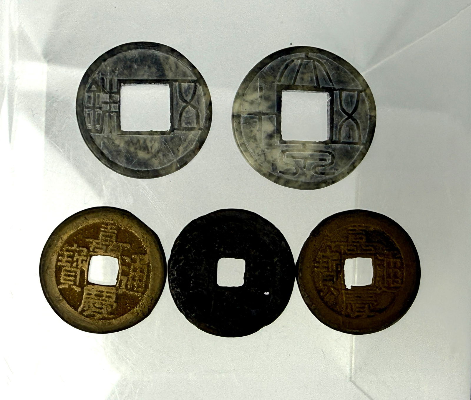 Group of 3 Chinese Bronze Coins and 2 Stone Coins: Group of 3 Chinese Bronze Coins(2 jieqing, 1 qianlong mark), and 2 jade Stone Coins Shizhu and Wu Zhu,Preview from Apr 20th to 24th from 1:00 PM TO 5:00 PM Eastern Time, Location: 15229 Display Court,