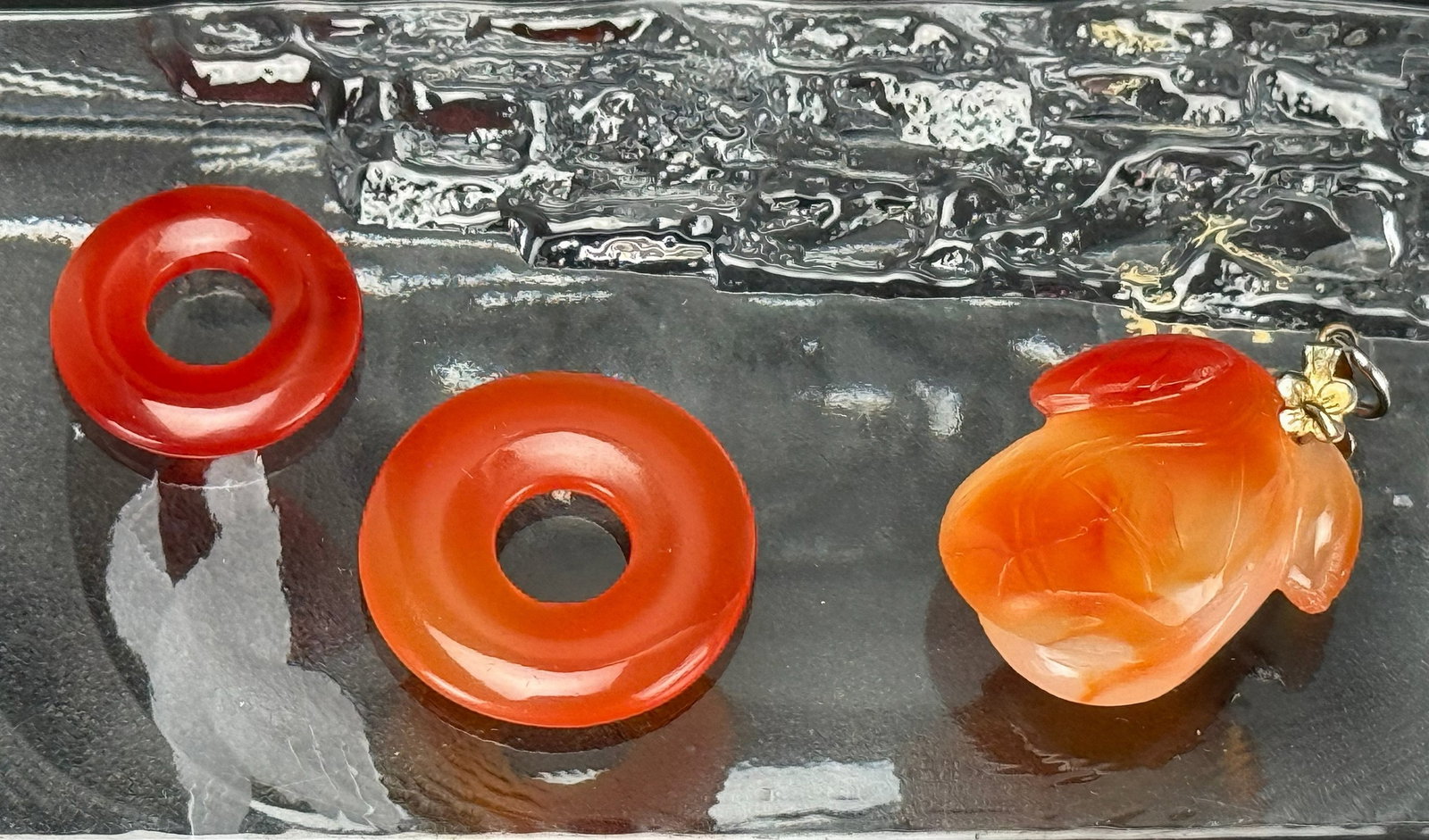 Three Chinese Red Agate Pendants: Three Chinese Red Agate Pendants, D 2.5 cm.Preview from Apr 20th to 24th from 1:00 PM TO 5:00 PM Eastern Time, Location: 15229 Display Court, Rockville, MD 20850.