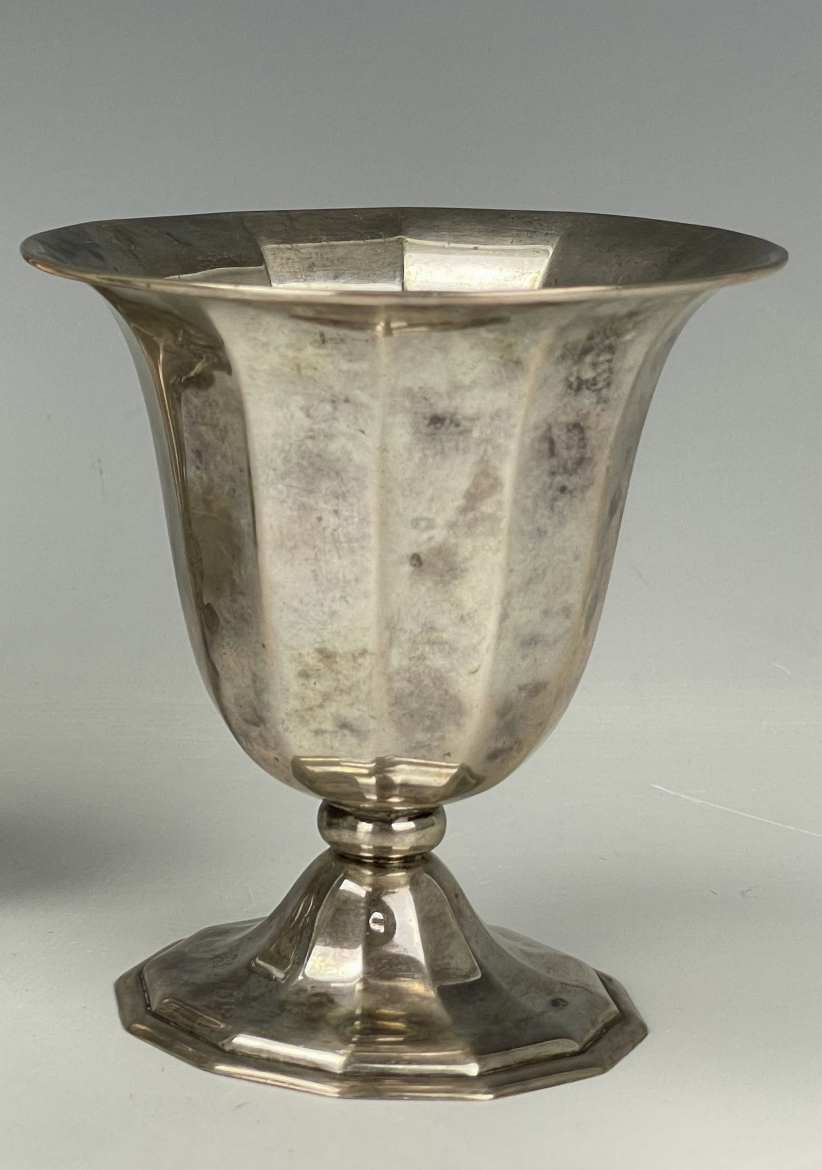 Small Silver Goblet with Flared Rim and Multi Faceted exterior walls: Small Silver Goblet with Flared Rim and Multi Faceted exterior walls, H 9cm(3.6 in.),total 90 grams.Preview from Apr 20th to 24th from 1:00 PM TO 5:00 PM Eastern Time, Location: 15229 Display Court, R