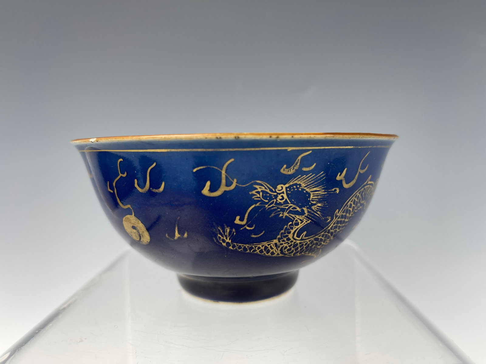 Chinese Blue Glazed Gilt Dragon Porcelain Bowl Qianlong: Chinese Blue Glazed Gilt Dragon Porcelain Bowl Qianlong. D 11.5cm(4.5in) x H 5.7cm (2.2in). Preview from Apr 20th to 24th from 1:00 PM TO 5:00 PM Eastern Time, Location: 15229 Display Court, Rockville