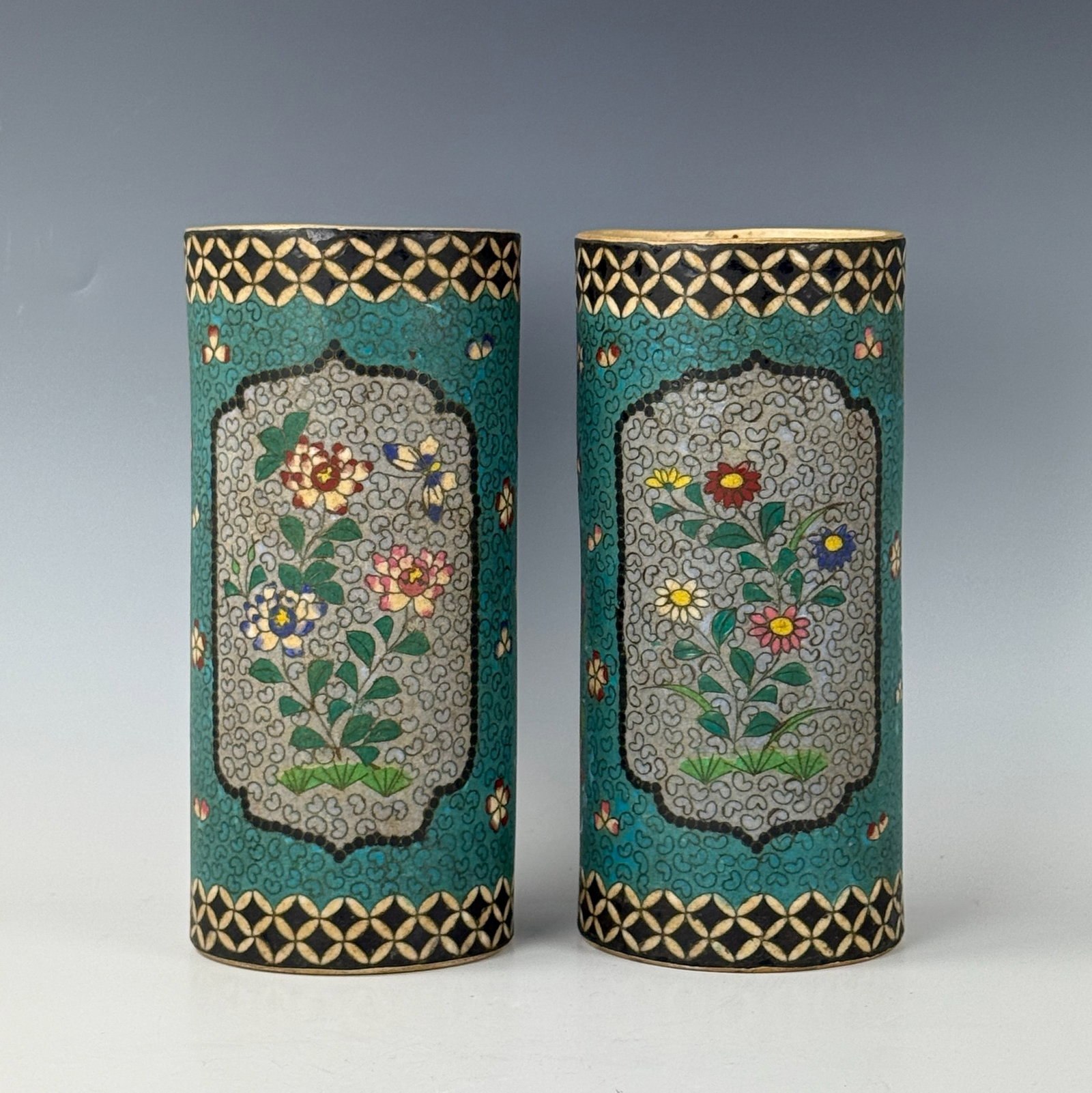 A Pair of Antique Japanese Cylindrical Enamel Porcelain Vases: A Pair of Antique Japanese Cylindrical Enamel Porcelain Vases. Size: H25cm (9.8in) x D11.5cm (4.5in)Preview from Apr 20th to 24th from 1:00 PM TO 5:00 PM Eastern Time, Location: 15229 Display Court, R