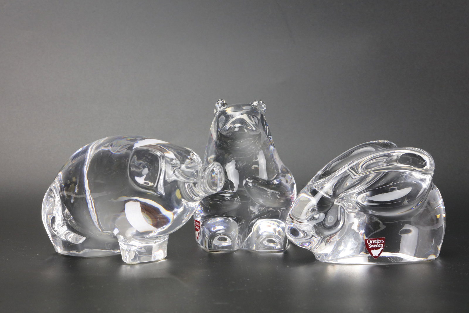 3 Pieces Orrefors Sweden Crystal Animal Figurines: Pig, Bear, and Rabbit. Pig H7cm(2.7in), Bear: 3 Pieces Orrefors Sweden Crystal Animal Figurines: Pig, Bear, and Rabbit. Pig H7cm(2.7in), Bear H10cm(4in), Rabbit H7cm(2.7in). Preview from Apr 20th to 24th from 1:00 PM TO 5:00 PM Eastern Time, Loca