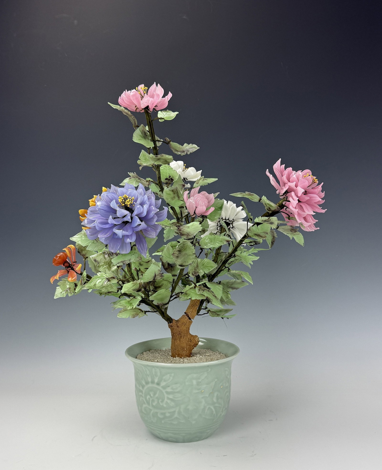 A Vintage Chinese Jade Glass Bonsai Tree: A Vintage Chinese Jade Glass Bonsai Tree and Flowers. H 49cm(19.3 in.)x W 37cm(14.6in.)x D 37cm(14.6in.), Pot size: H 13cm(5.1in.) x D 18cm(7.1in.). Preview from June 22nd to 26th from 1:00 PM TO 5:00