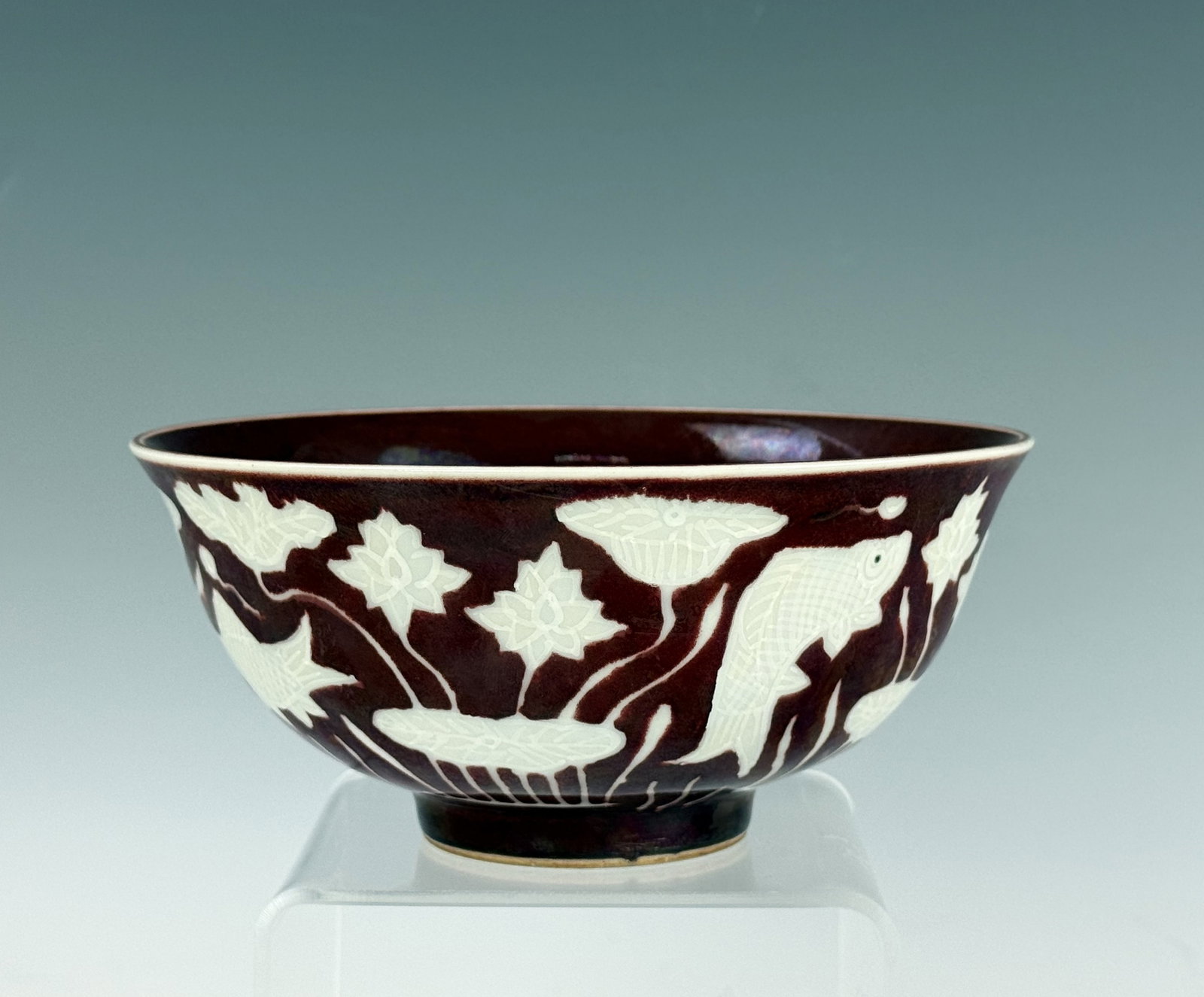 Chinese Red Glazed Incised Fish and Lotus Motif Porcelain Bowl Xuande Mark: Chinese Red Glazed Incised Fish and Lotus Motif Porcelain Bowl Xuande Mark. D 16 cm(6.3 in.) x H 7 cm(2.8 in.). Preview from June 22nd to 26th from 1:00 PM TO 5:00 PM Eastern Time, Location: 15229 Dis
