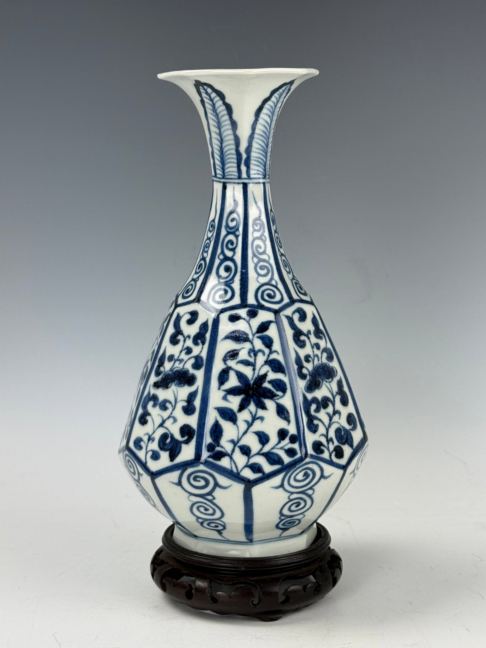 Chinese Blue and White Porcelain Octagonal YUHUCHUN Vase: An octagonal YUHUCHUN vase with floral patterns and banana leaves. H 26.5 cm(10.4 in.). Preview from June 22nd to 26th from 1:00 PM TO 5:00 PM Eastern Time, Location: 15229 Display Court, Rockville, M