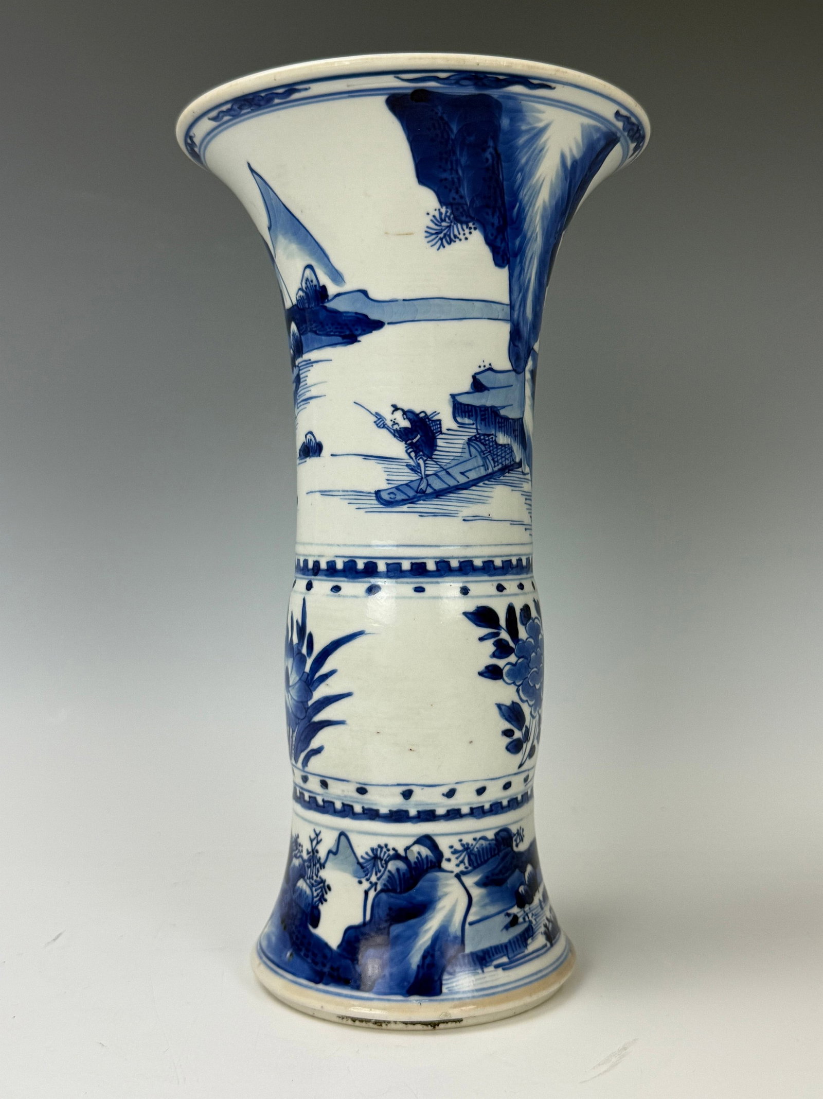 A Chinese Kangxi Blue and White Porcelain Gu Vase: A Chinese Kangxi Blue and White Porcelain Gu Vase,H 23.8 cm(9.5 in.). Preview from June 22nd to 26th from 1:00 PM TO 5:00 PM Eastern Time, Location: 15229 Display Court, Rockville, MD 20850.