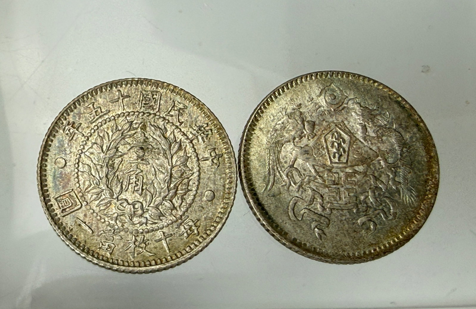 Two China 1926 Dragon and Phoenix Ten Cents Silver Coins: Two China 1926 Dragon and Phoenix Ten Cents Silver Coins. Preview from June 22nd to 26th from 1:00 PM TO 5:00 PM Eastern Time, Location: 15229 Display Court, Rockville, MD 20850.