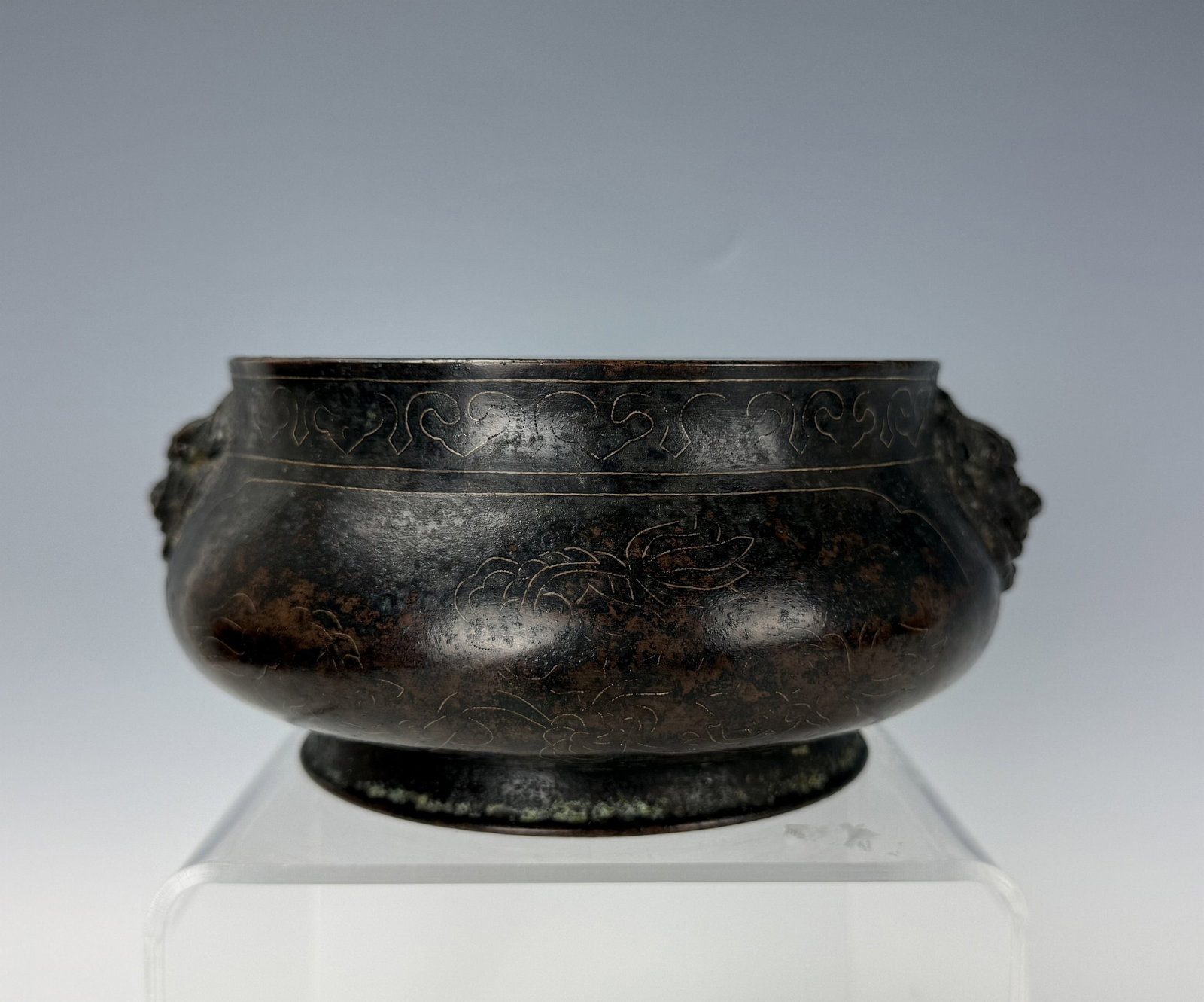 A Chinese Bronze Incense Burner with Shishou Mark: A Chinese bronze incense burner with Xuande Mark. D 18cm(7in.) x H 7cm(3in.). Preview from June 22nd to 26th from 1:00 PM TO 5:00 PM Eastern Time, Location: 15229 Display Court, Rockville, MD 20850.