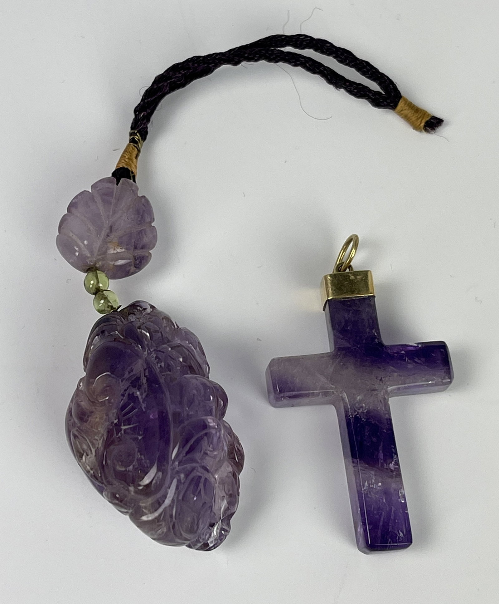 Amethyst Carved Pendants of Reishi Mushroom and a Cross: Amethyst carved pendants of grapes and a cross. Grapes L 12.5 cm(4.9in.), Cross L 4cm(1.6 in.). Preview from June 22nd to 26th from 1:00 PM TO 5:00 PM Eastern Time, Location: 15229 Display Court,