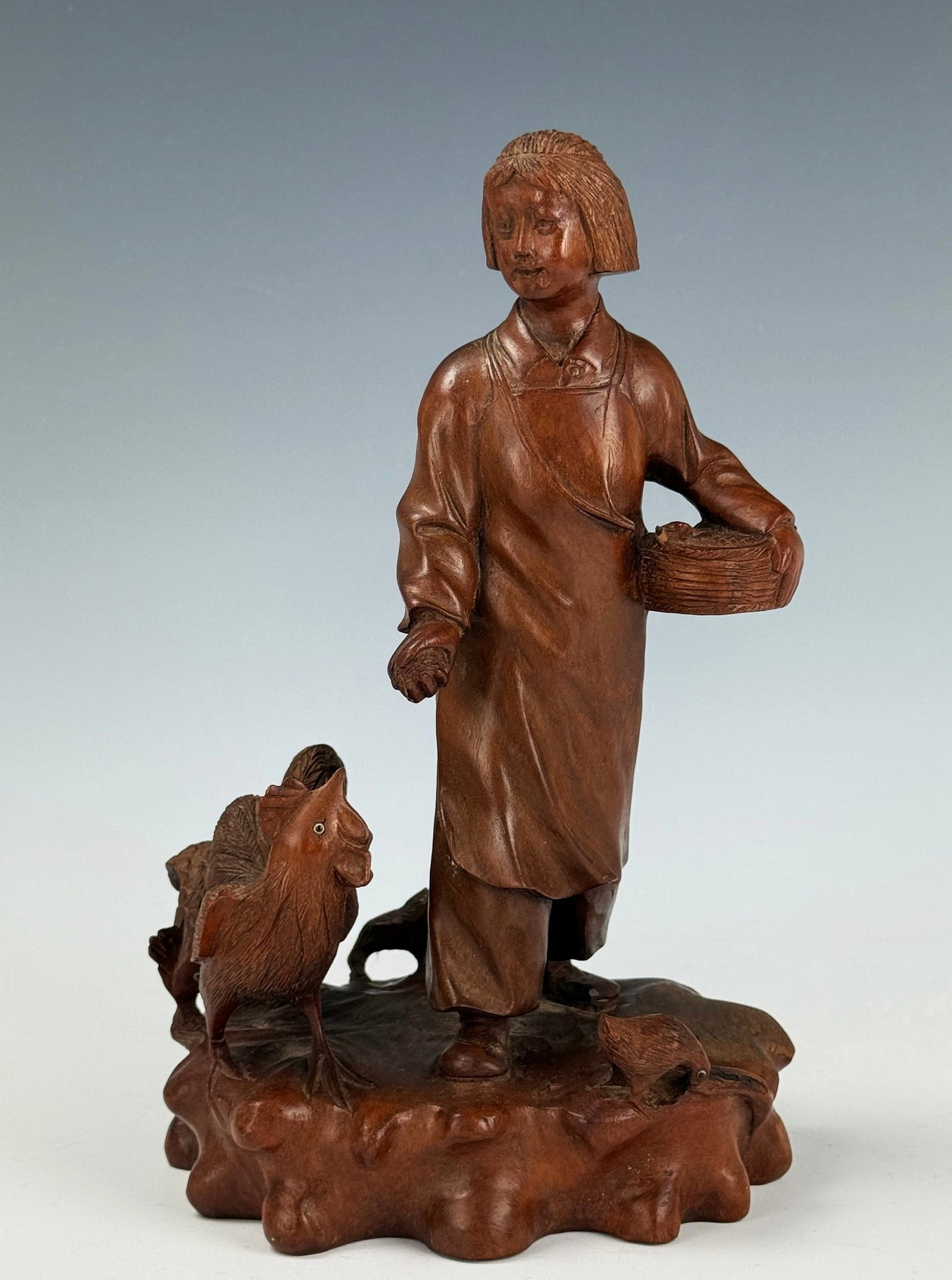 Chinese Hand Carved Wooden Sculpture of A Girl Feeding Chicken: Chinese Cultural Revolution figurine,Girl Feeding rooster.H 26 cm(10.2 in.) x W 15 cm(6 in.)x H 12 cm(5 in.). Preview from June 22nd to 26th from 1:00 PM TO 5:00 PM Eastern Time, Location: 15229 Displ
