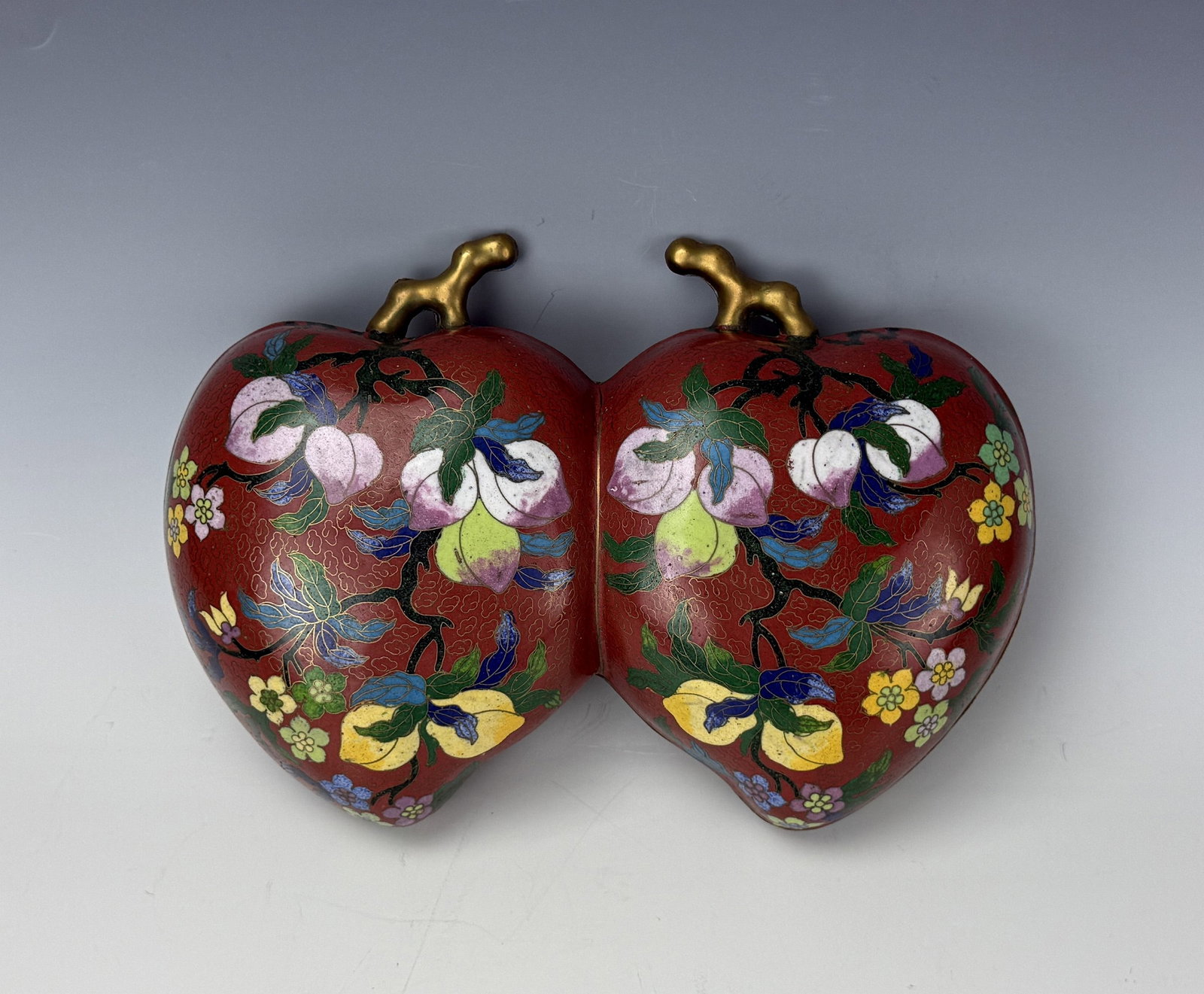 Chinese Cloisonne Double Peach Box with Floral Enamel Decoration: Chinese cloisonne double peach box with floral enamel decoration. L 30.5cm(12in.) x W 20cm(8in.) x H 10cm(4in.). Preview from June 22nd to 26th from 1:00 PM TO 5:00 PM Eastern Time, Location: 15229 Di