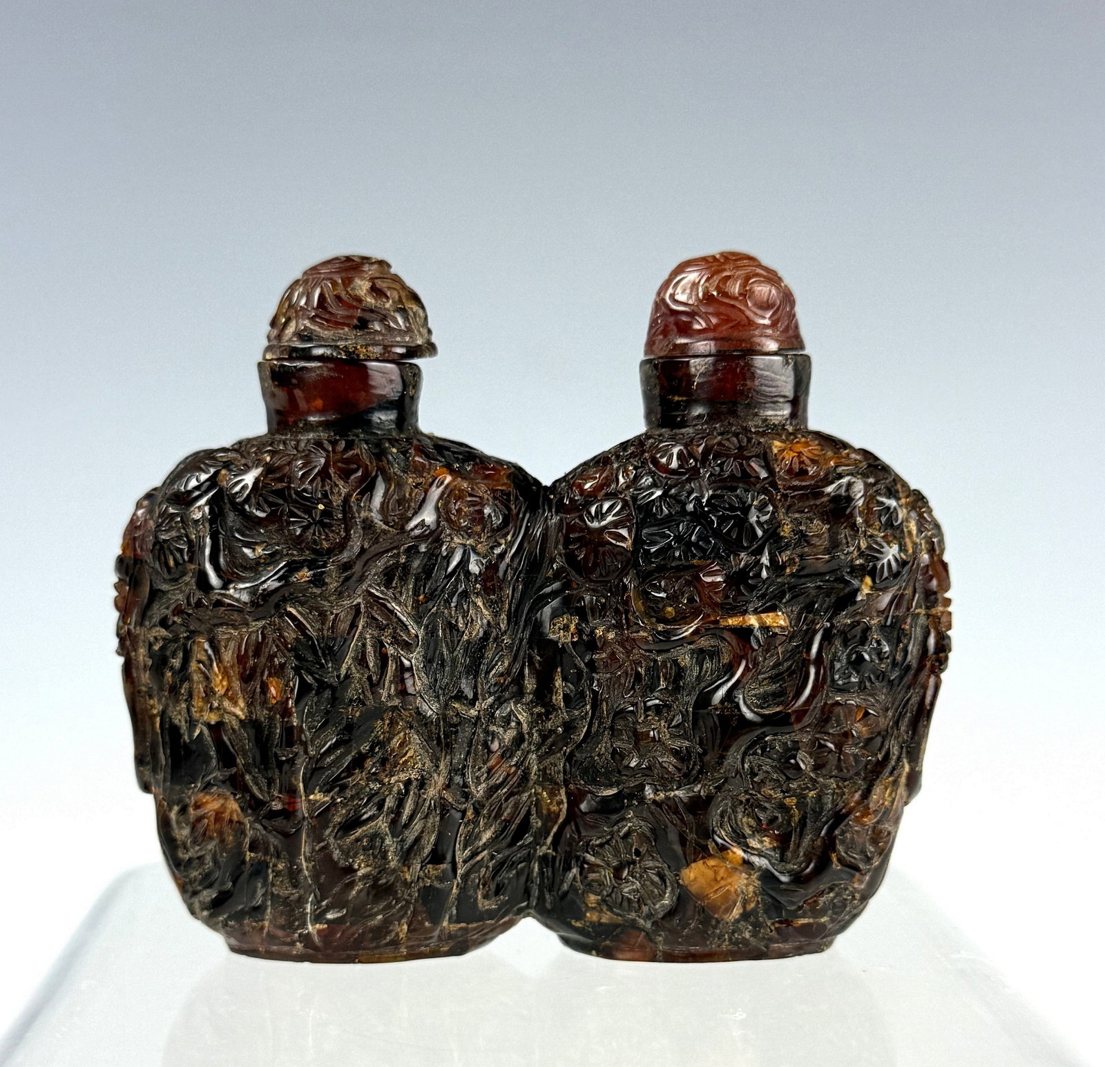 Chinese Carved Amber Double Snuff Bottle: Amber double snuff bottle carved with landscape and scholars. H 8.7cm(3.4 in.) x W 8cm(3.1in.). Preview from June 22nd to 26th from 1:00 PM TO 5:00 PM Eastern Time, Location: 15229 Display Court, Rock