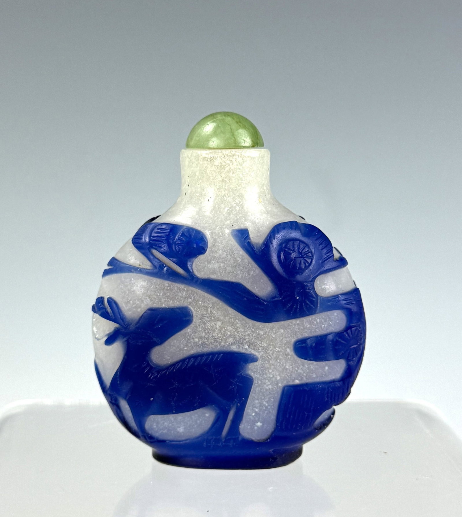 Vintage Opaque Peking Glass Snuff Bottle Blue Overlay: Opaque Peking glass snuff bottle with blue overlay of pine tree and cranes. H 6.5cm(2.6in.) x W 5cm(2in.). Preview from June 22nd to 26th from 1:00 PM TO 5:00 PM Eastern Time, Location: 15229 Display 